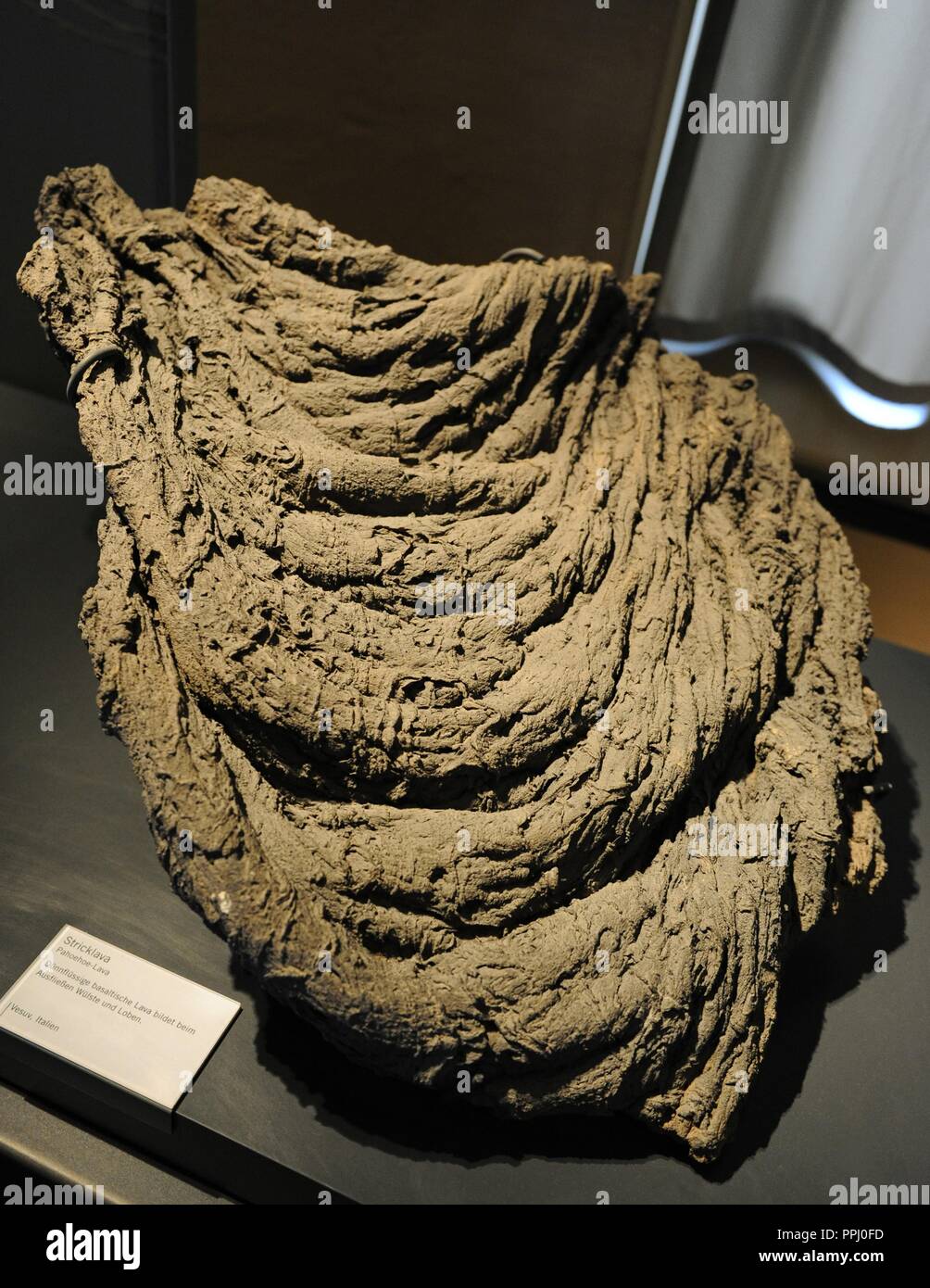Fluid lava emitted by a volcano during its eruptions. Exemplary lava flow of the Pahoehoe type or cordaba, from Vesuvius, Italy. Generally of Basaltic lavas. Museum fur Naturkunde. Berlin. Germany. Europe. Stock Photo