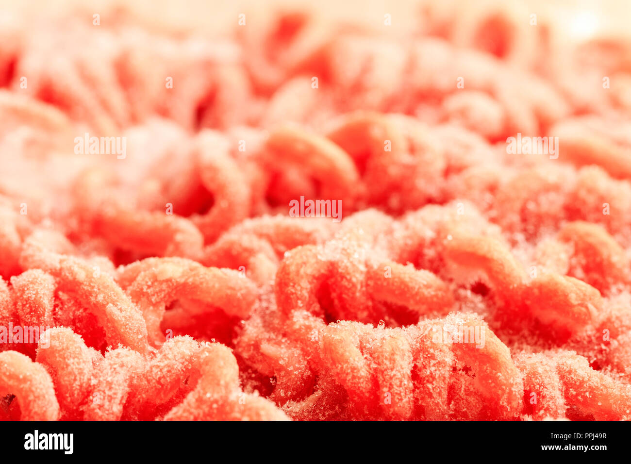 Close up of frozen mincemeat defrosting. Marco shot. Pattern Stock Photo
