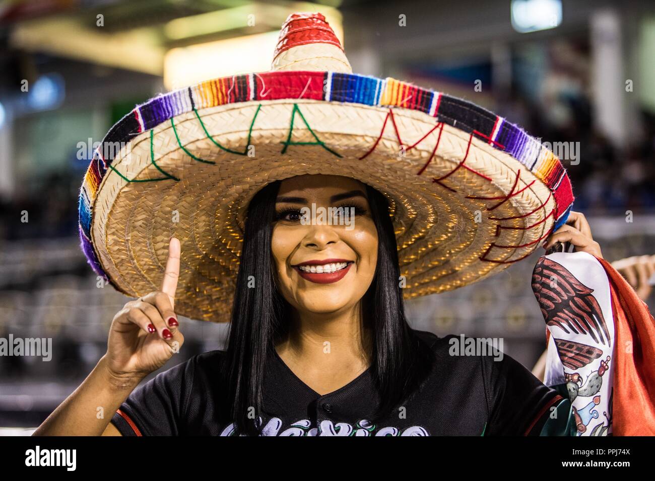 Aficionada mexicana  con susombrero de charro, durante la   Serie del Caribe en estadio de los Charros de Jalisco en Guadalajara, México, Martes 6 feb Stock Photo