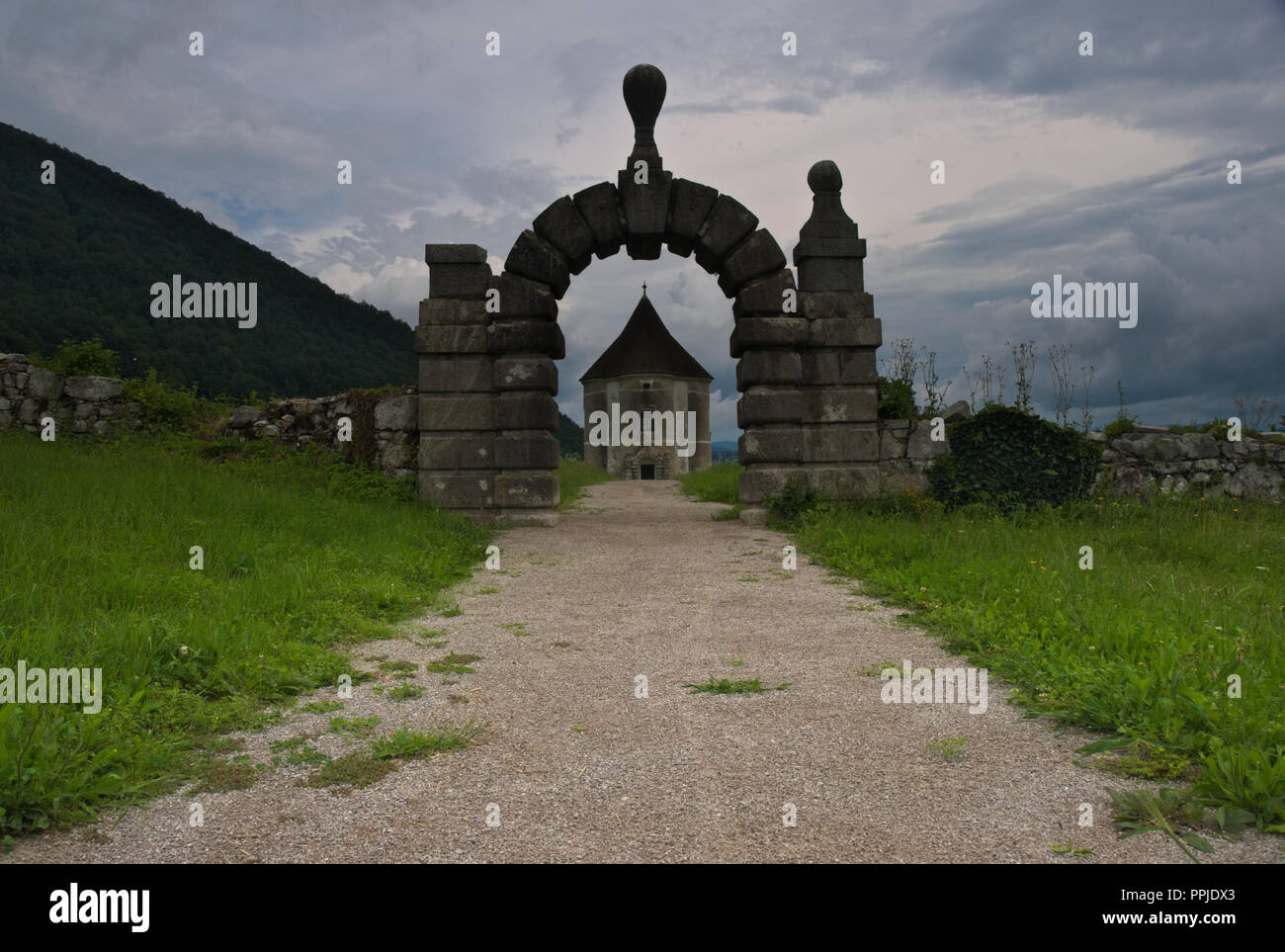 Path leading to Soteska Manor and Hudicev turn. Soteska village, Slovenia Stock Photo