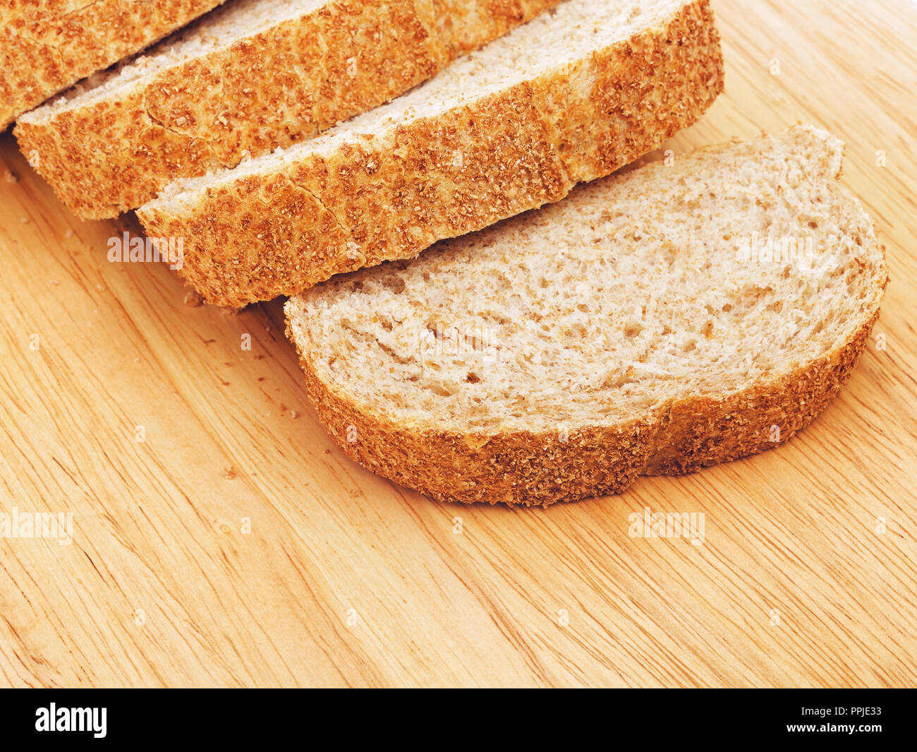 sliced wholegrain white bread lying on cutting board Stock Photo - Alamy