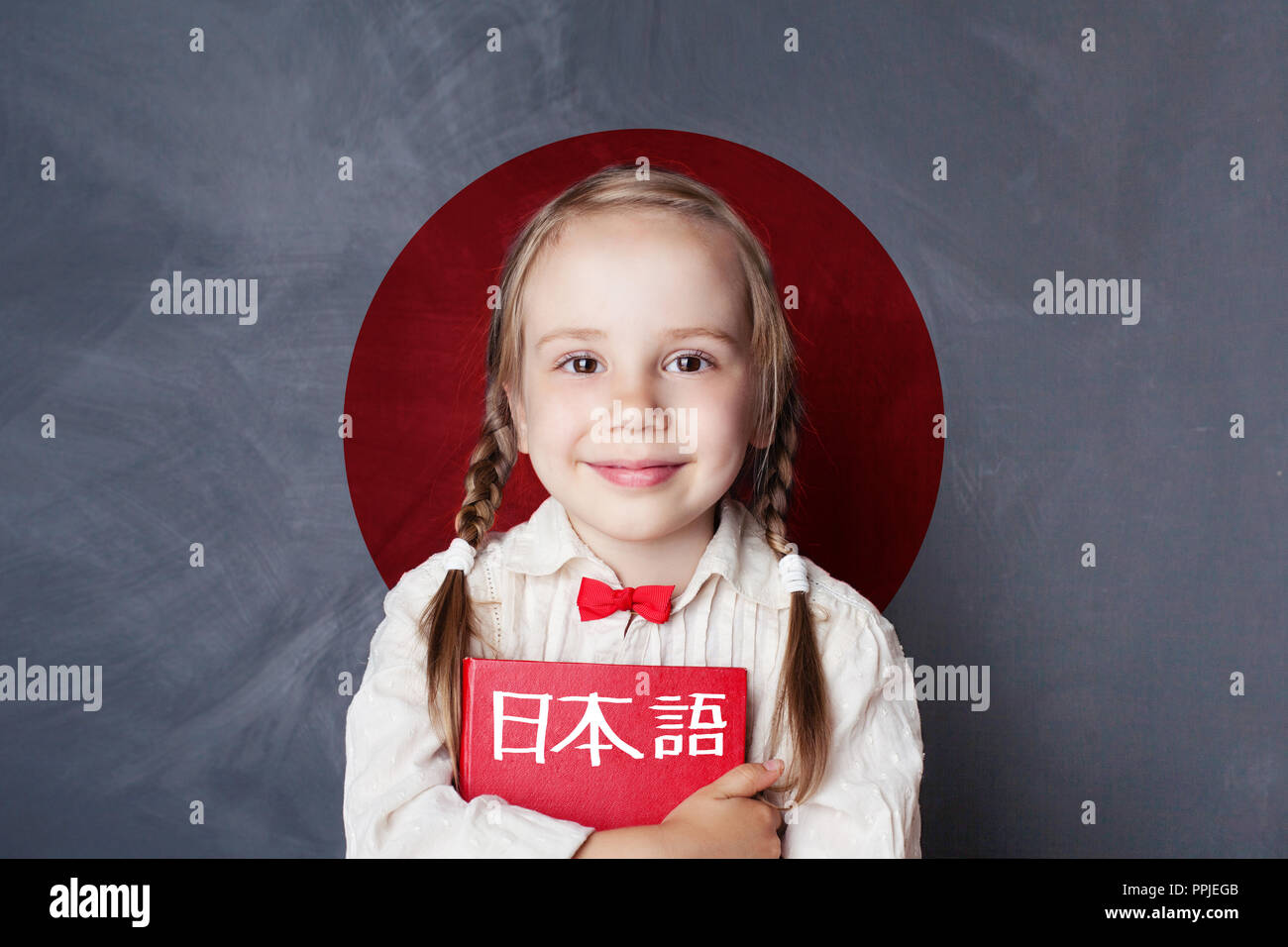 Learn japanese language. Smiling kid pupil on Japan flag background