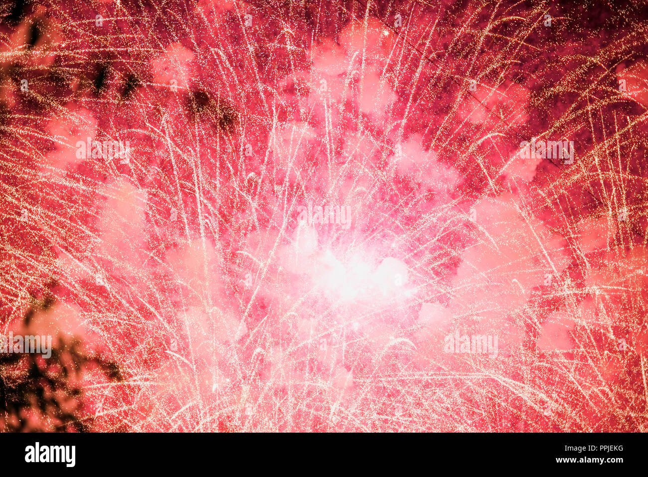 Sparkling explosion of fireworks, Christmas celebration neon Stock Photo