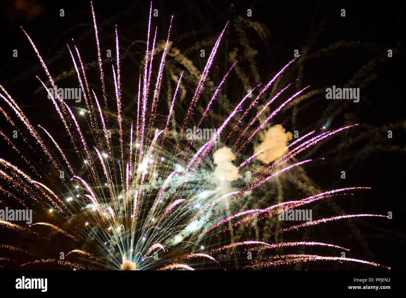 Christmas celebration neon sparkling explosion of fireworks Stock Photo