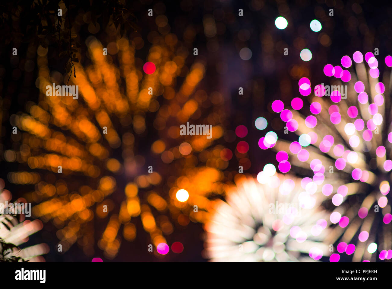 Colorful firework. Amazing fireworks with bokeh from drops on the lens, fireworks 2019, fireworks background, fireworks event, Celebration in the town Stock Photo