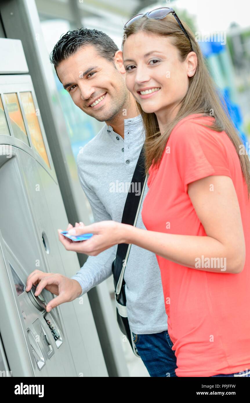 Couple buying a tram ticket Stock Photo Alamy