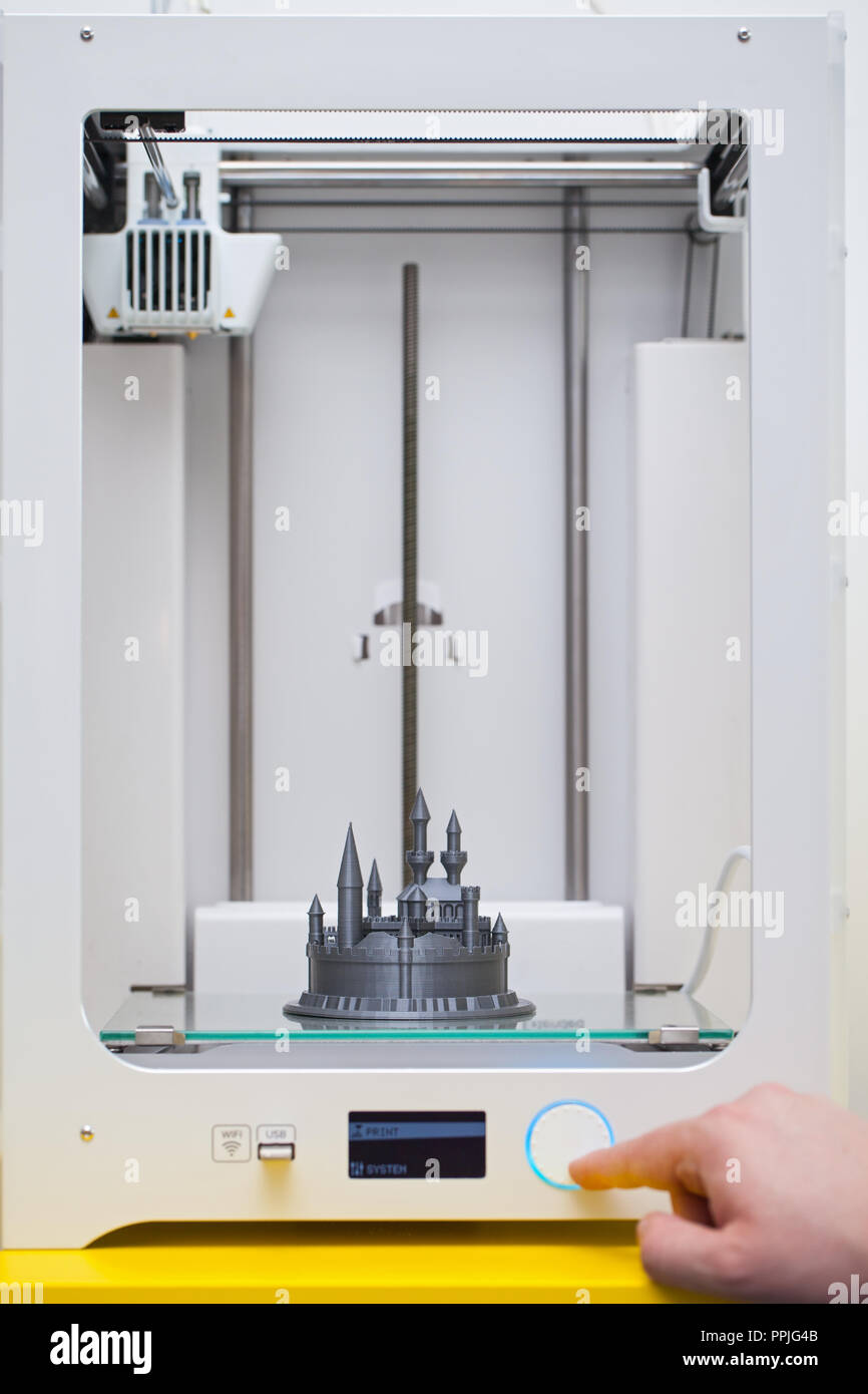 White 3D printer during work. Plastic castle - disney figure almoust done Stock Photo