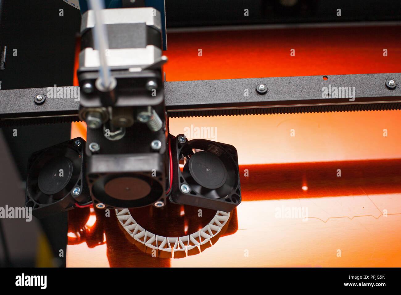 Modern three-dimensional printer during work. Close up printing detail Stock Photo