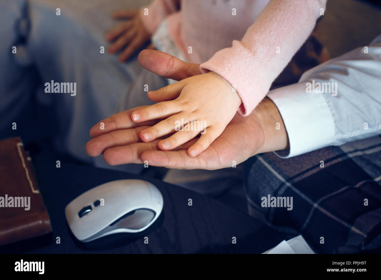 Close up hands of father and his daughter Stock Photo