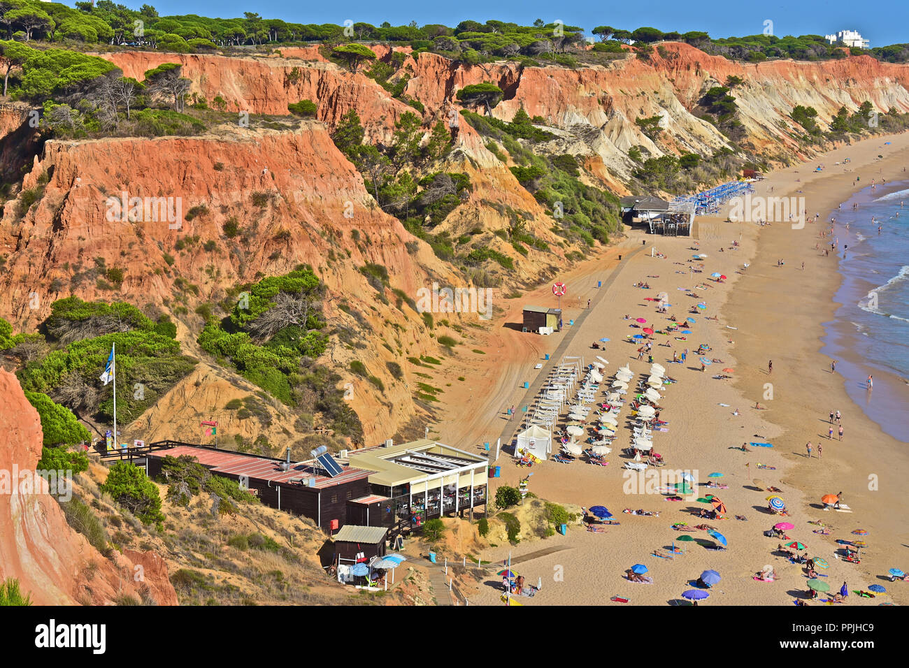 The wonderful golden sandy beach at Praia de Falésia stretches than six kilometres from Vilamoura to Olhos d'Agua, in the Algarve region of Portugal. Stock Photo