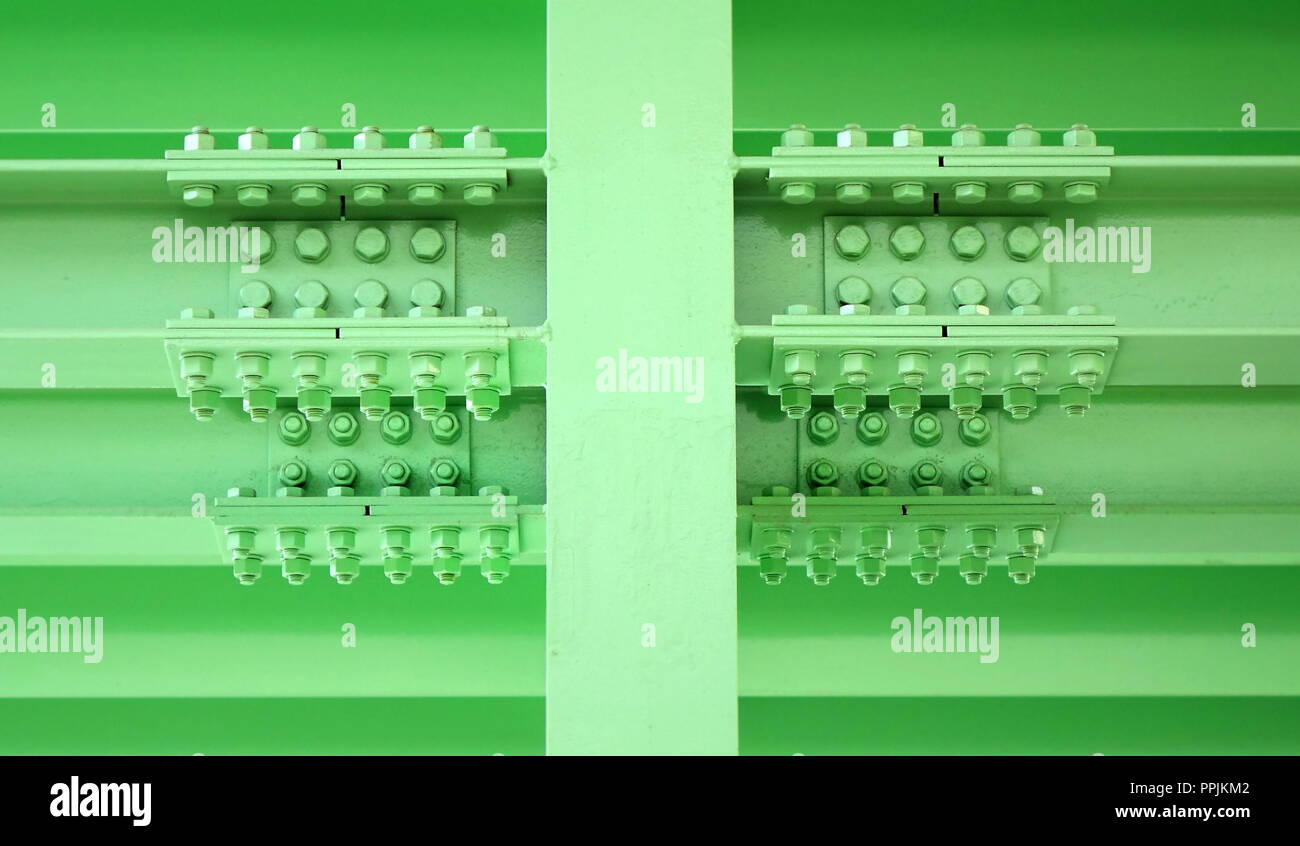 Massive steel girder construction with multiple large bolts and nuts