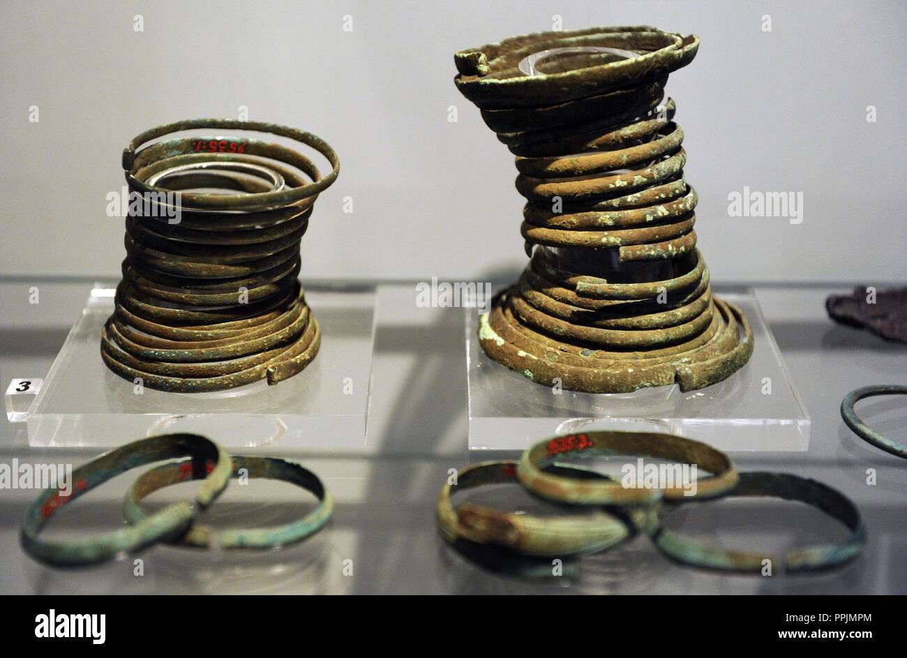 Bronze objects. Bracelets from graves of the Piikkio cemetery. National Museum of Finland. Helsinki. Stock Photo