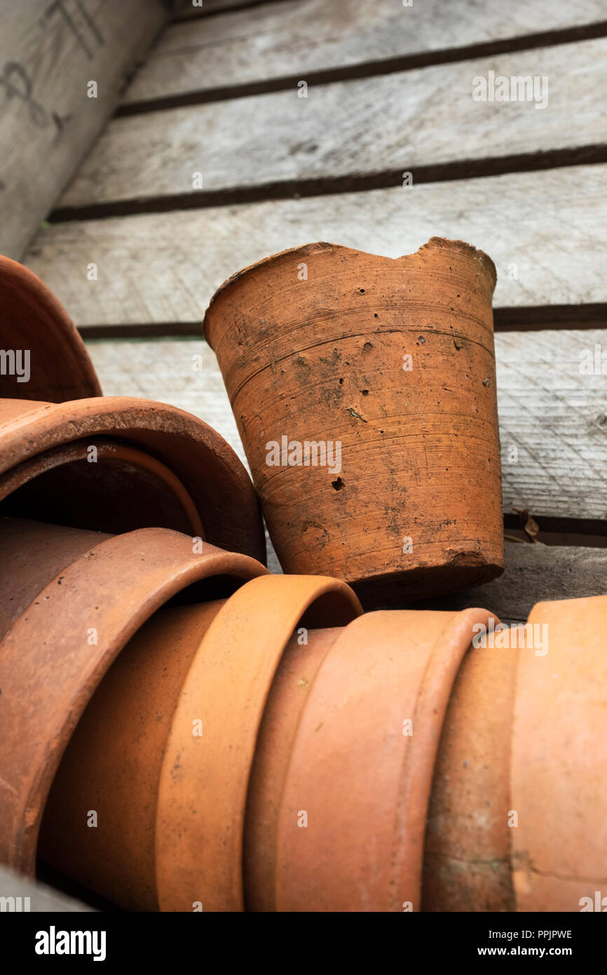 Old terracotta pots in a wooden crate. Stock Photo