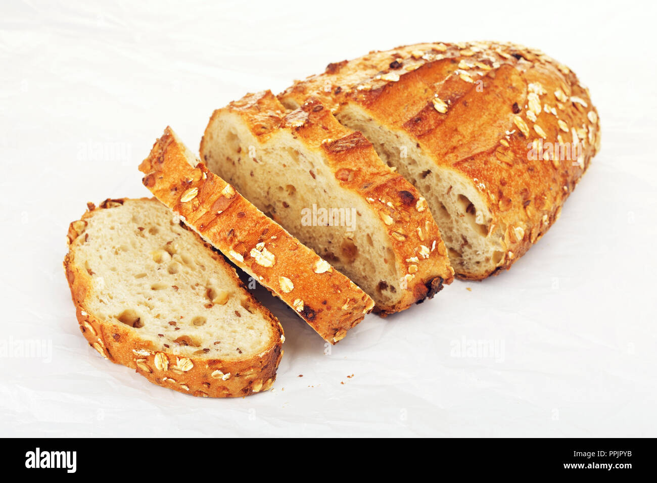 sliced wholegrain bread with oats and nuts, on paper Stock Photo Alamy
