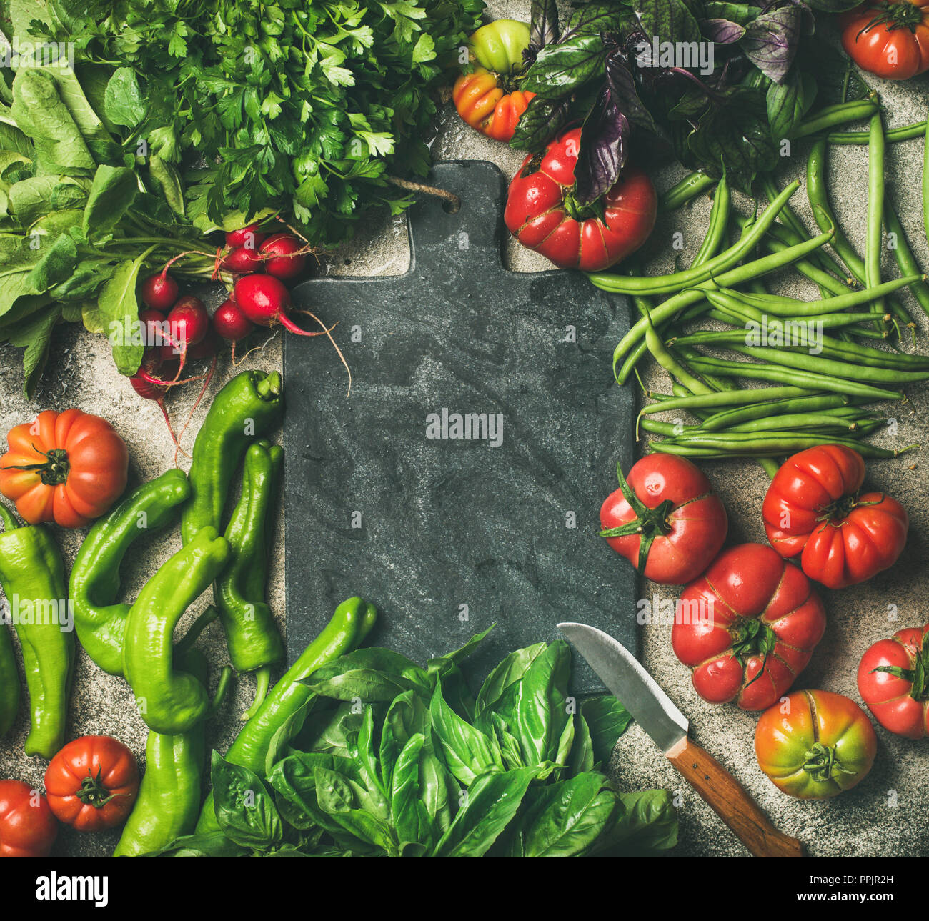 Healthy vegan food background with seasonal vegetables and greens Stock