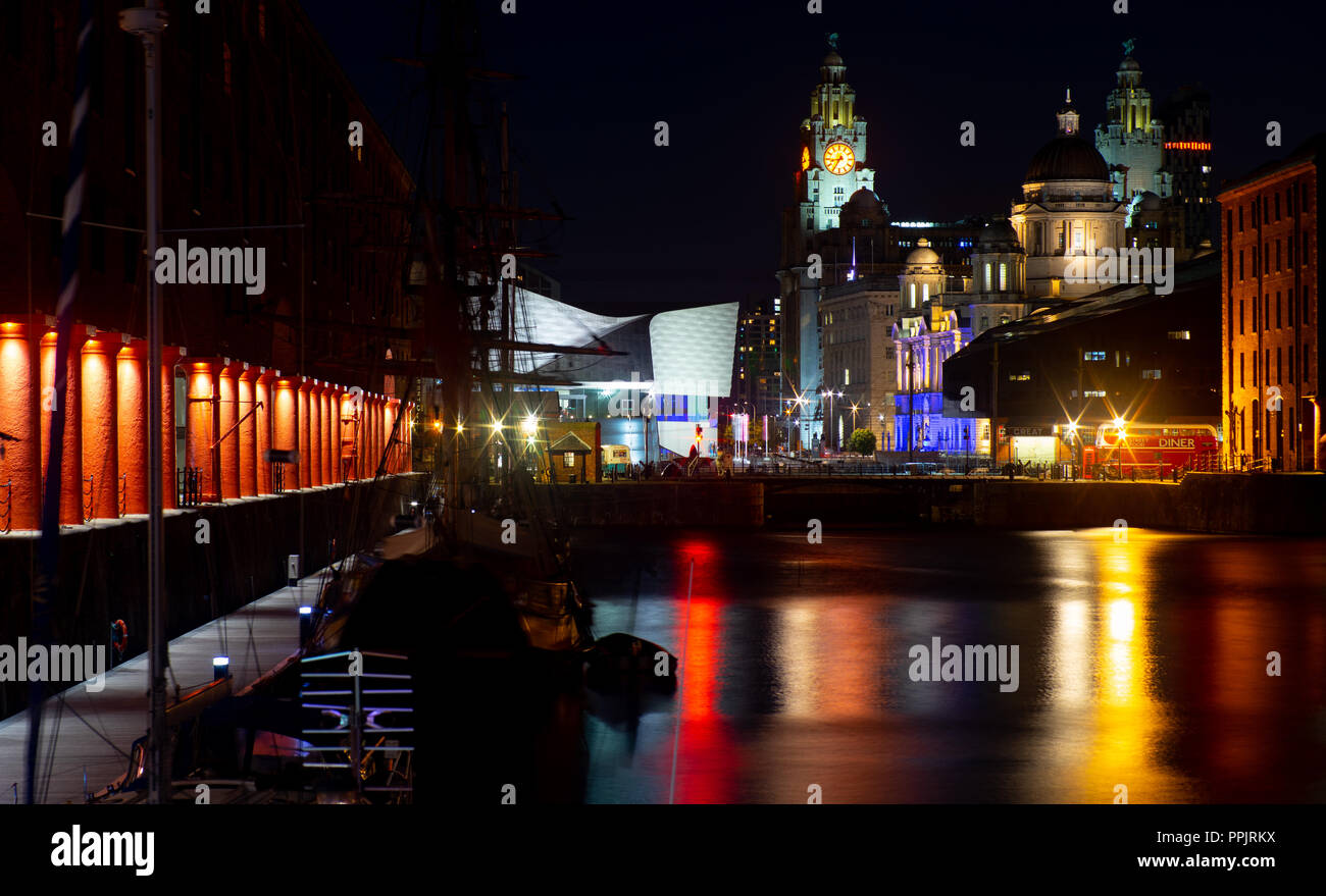 The Albert Dock at night, with The Three Graces in the background, including The Liver Building, Cunard and Dock Board Building. Taken September 2018. Stock Photo