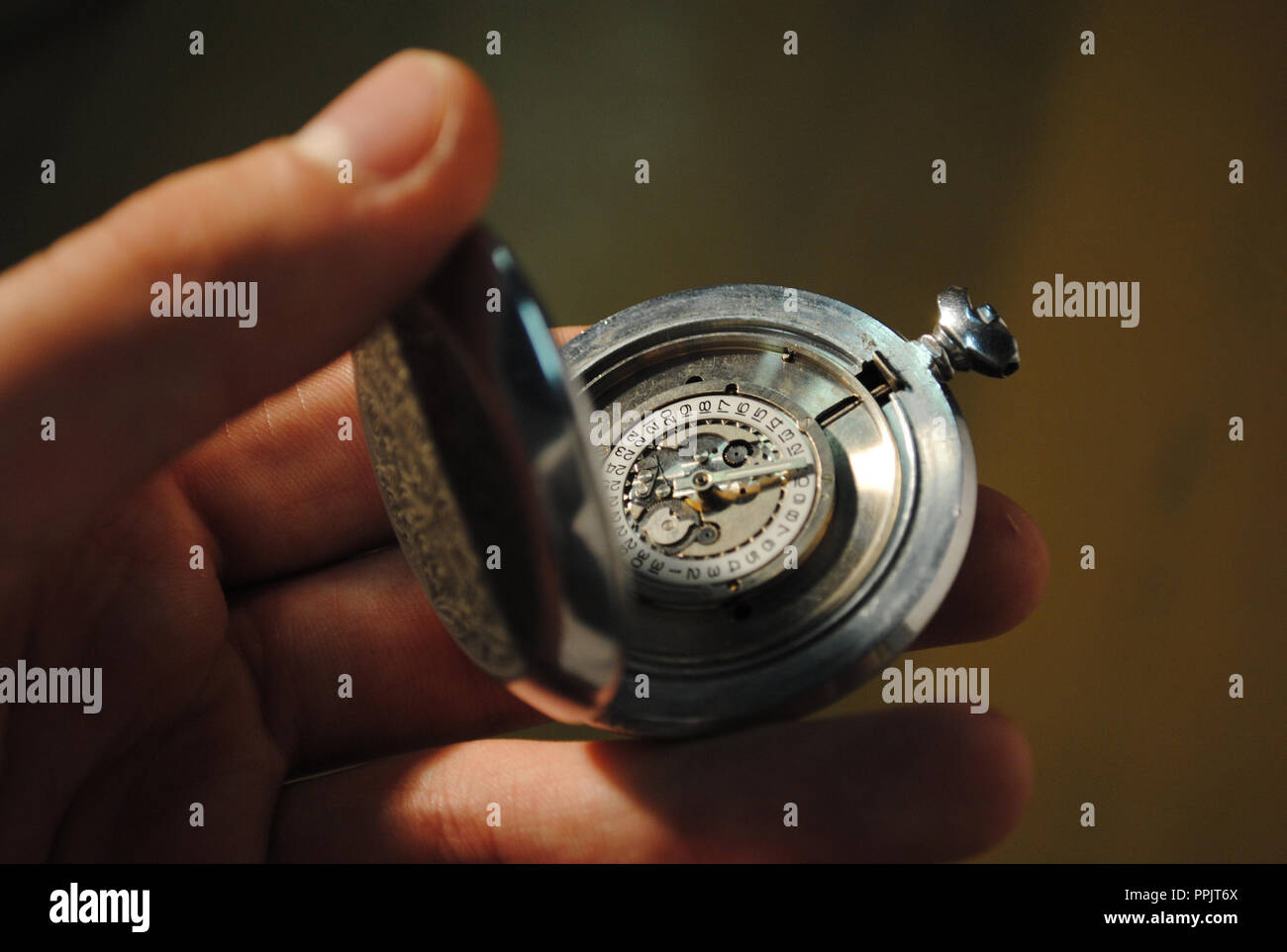 Antique clock in hand Stock Photo Alamy