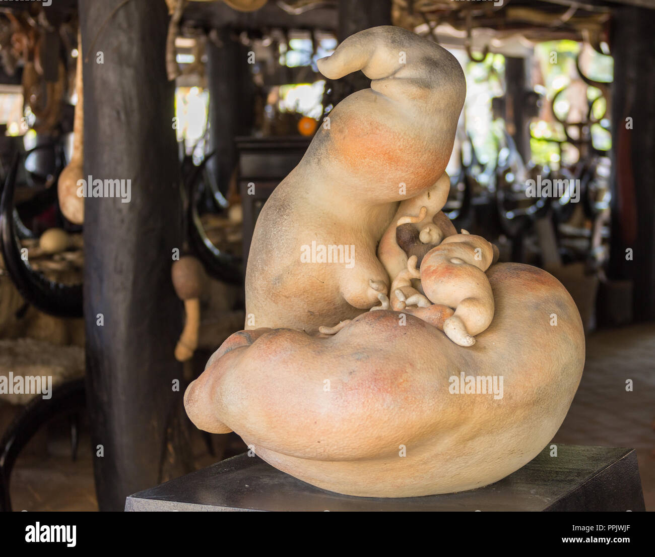 CHIANG MAY / THAILAND - 2016 JANUARY 12: Strange statue near white temple in Chiang Mai. Place a modern and very tourist. Stock Photo