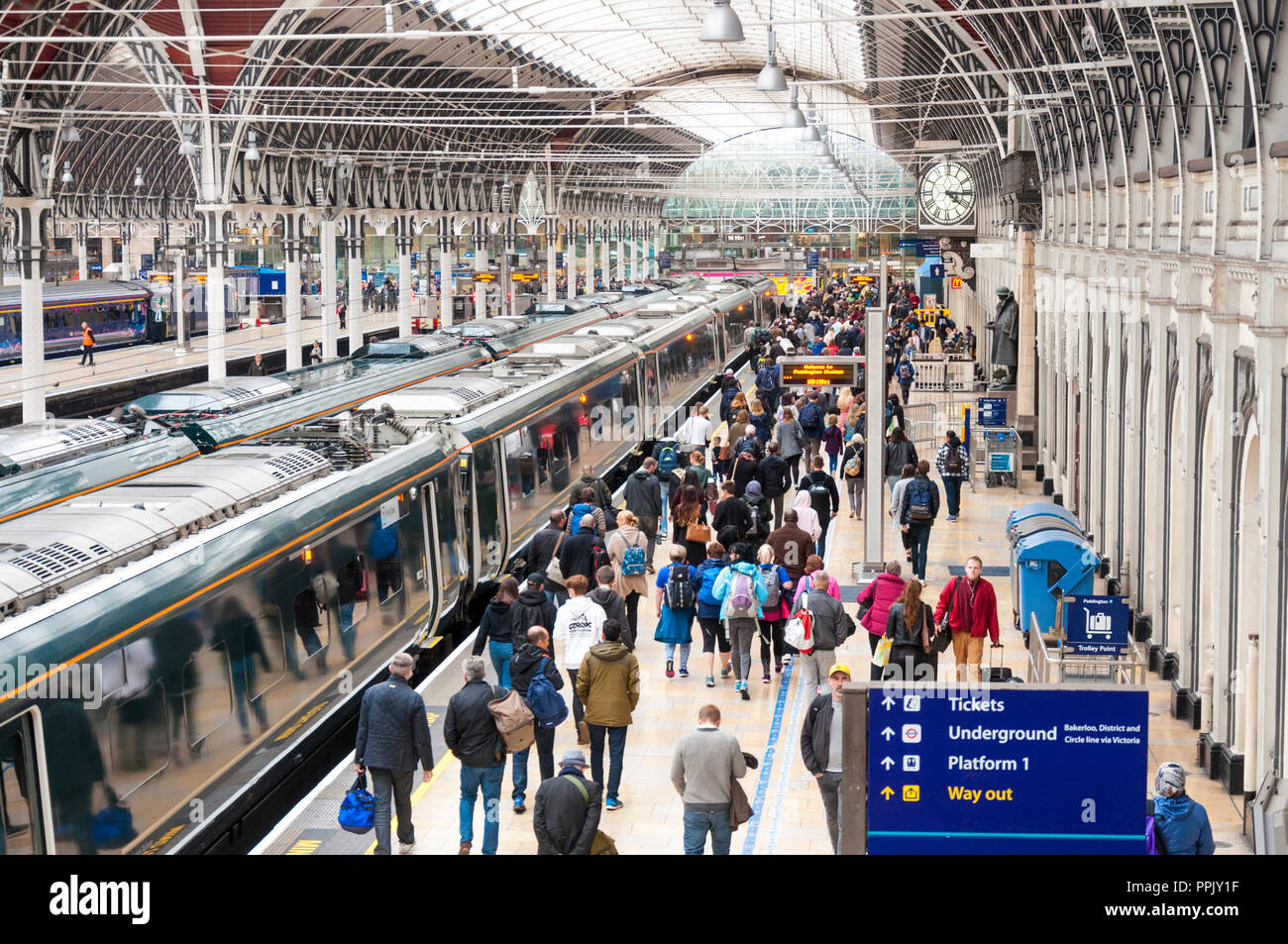 Passengers on platform of Paddington Railway Station, London, UK Stock Photo