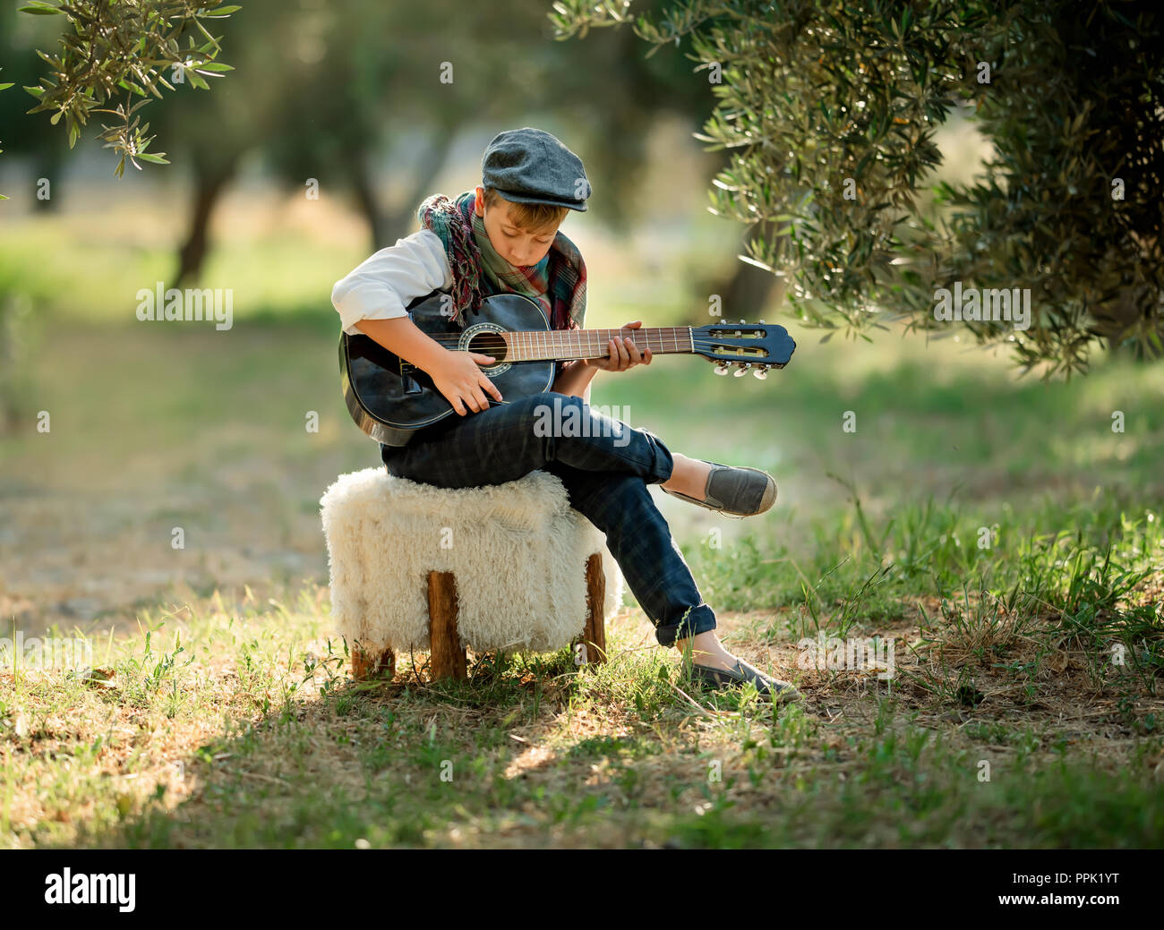 cute boy playing guitar
