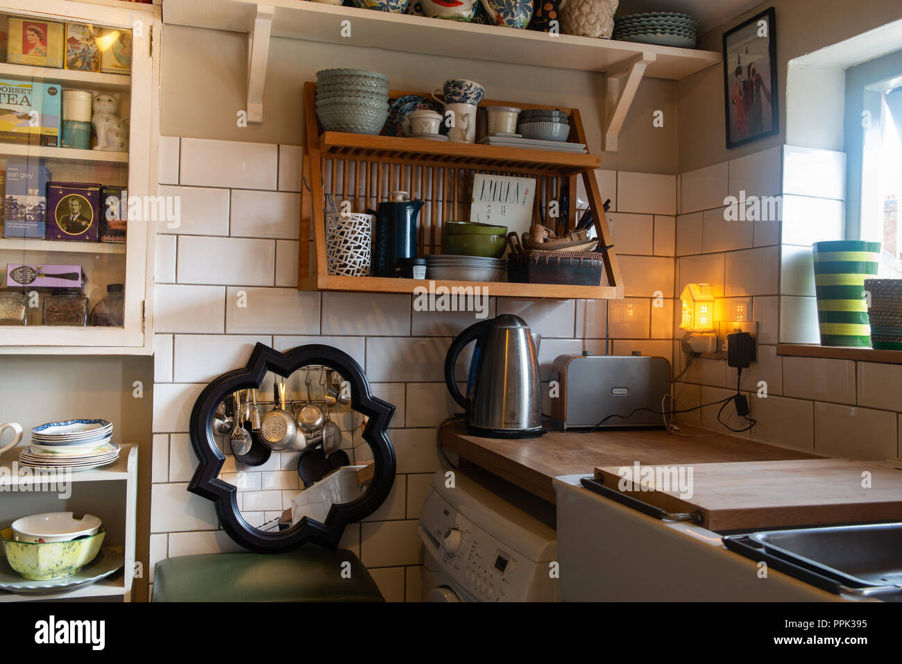 Old fashioned style kitchen with vintage cooking utensils, belfast sink
