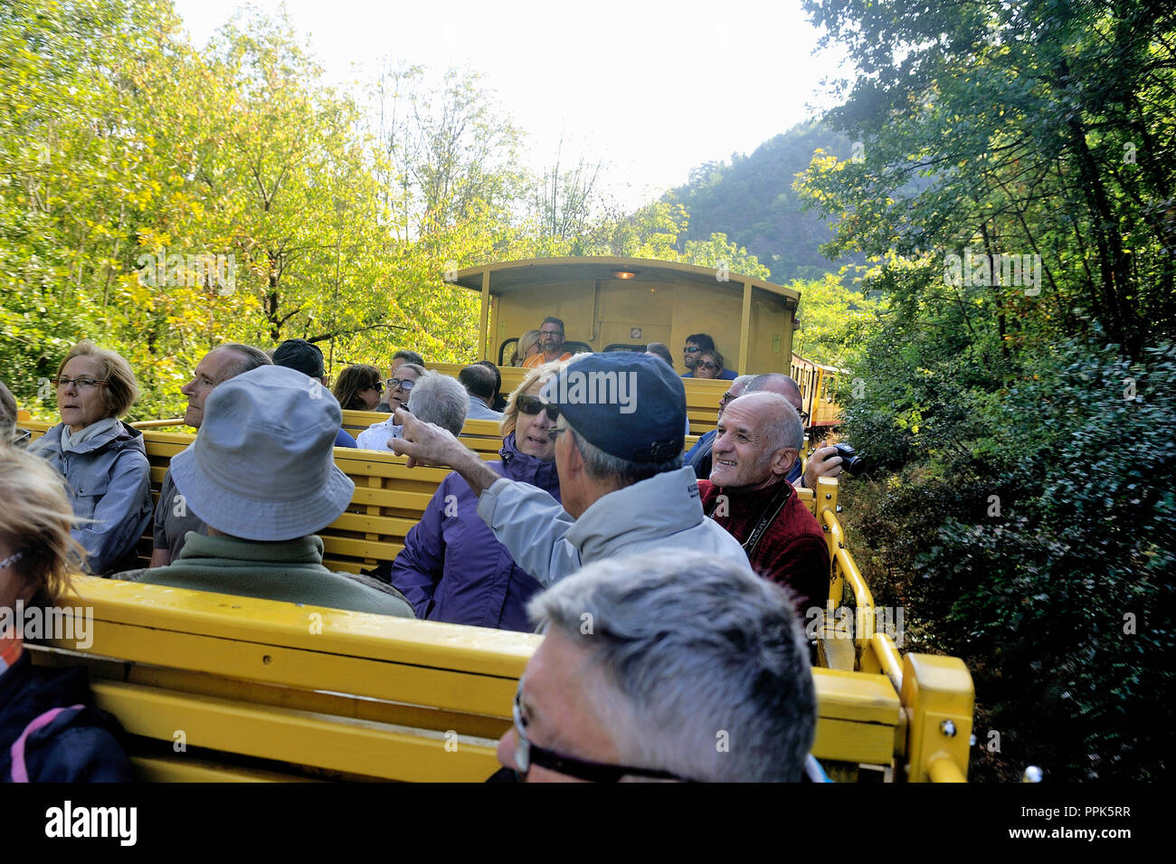 the traveler in the discovered wagon of the yellow Pyrénnées train Stock Photo