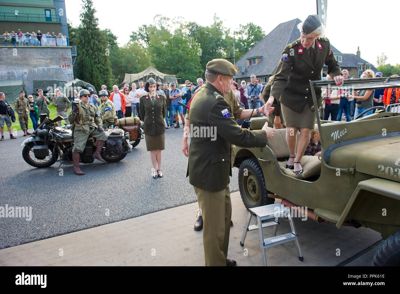 ENSCHEDE, THE NETHERLANDS - 01 SEPT, 2018: A singer from 'Sgt. Wilson's army show' stepping out of a jeep during a military army show. Stock Photo