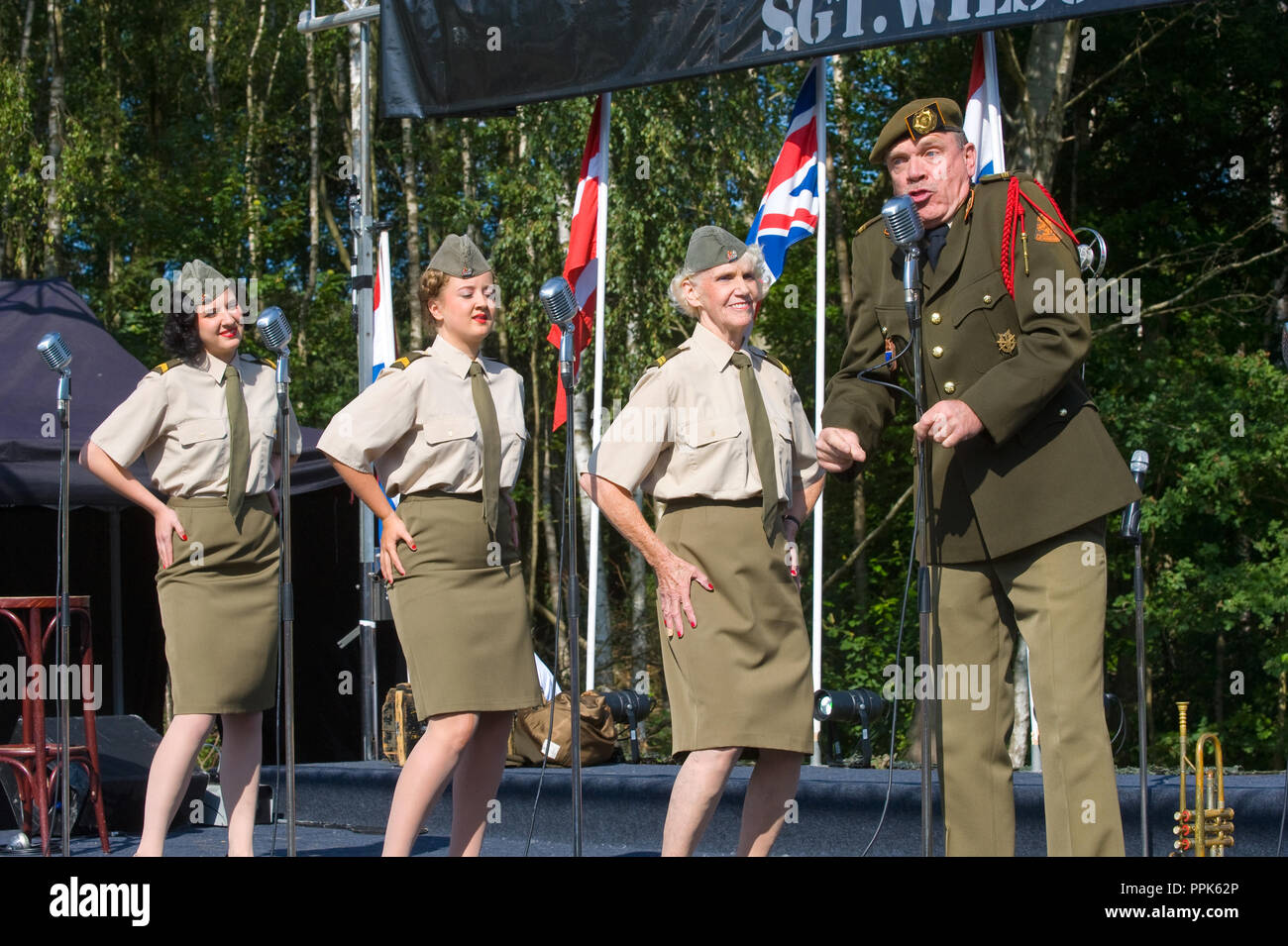 ENSCHEDE, THE NETHERLANDS - 01 SEPT, 2018: 'Sgt. Wilson's army show 'doing their stage act with historic forties songs during a military army show. Stock Photo