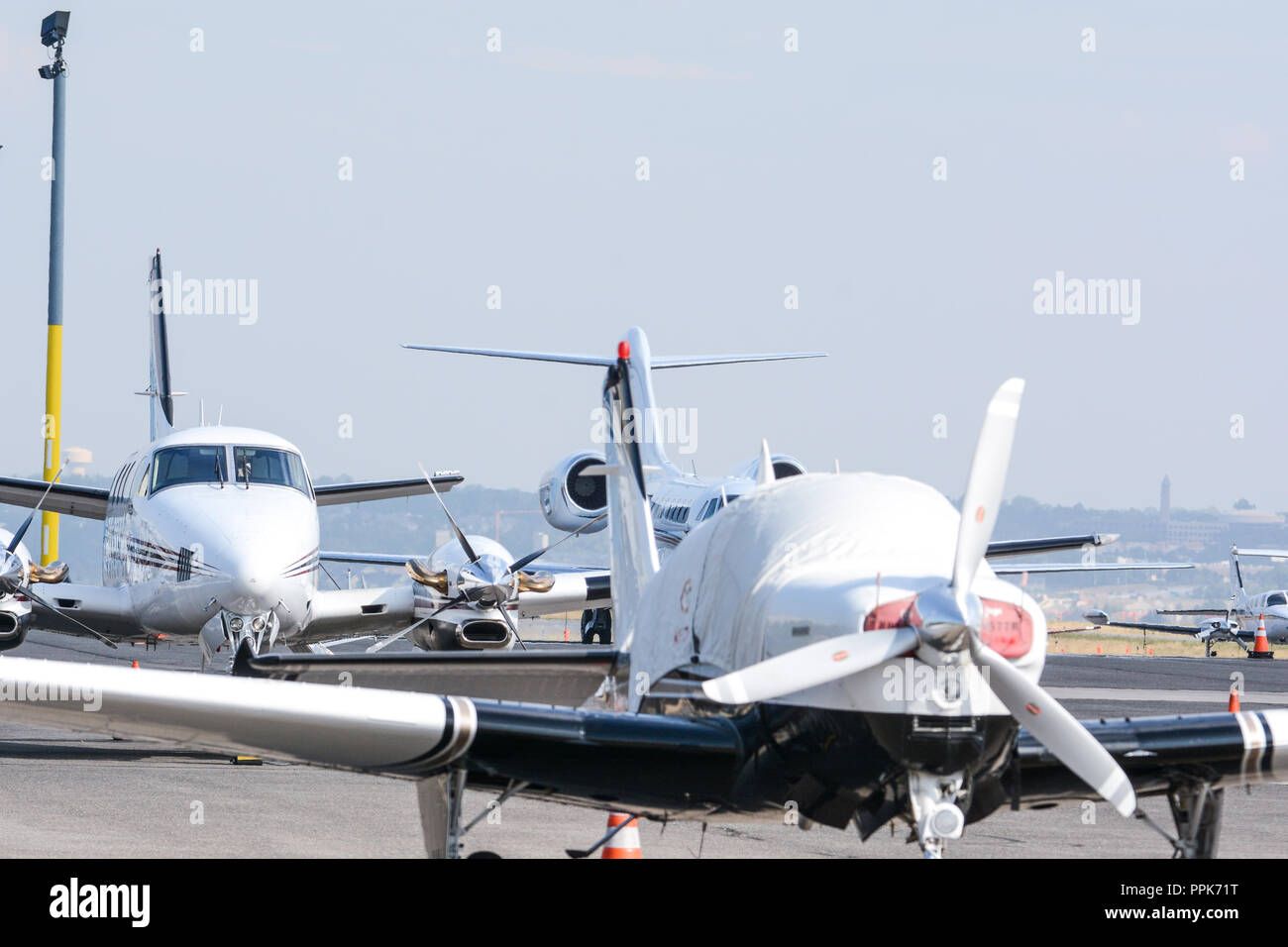 Luxury private jets lined up on the runway Stock Photo