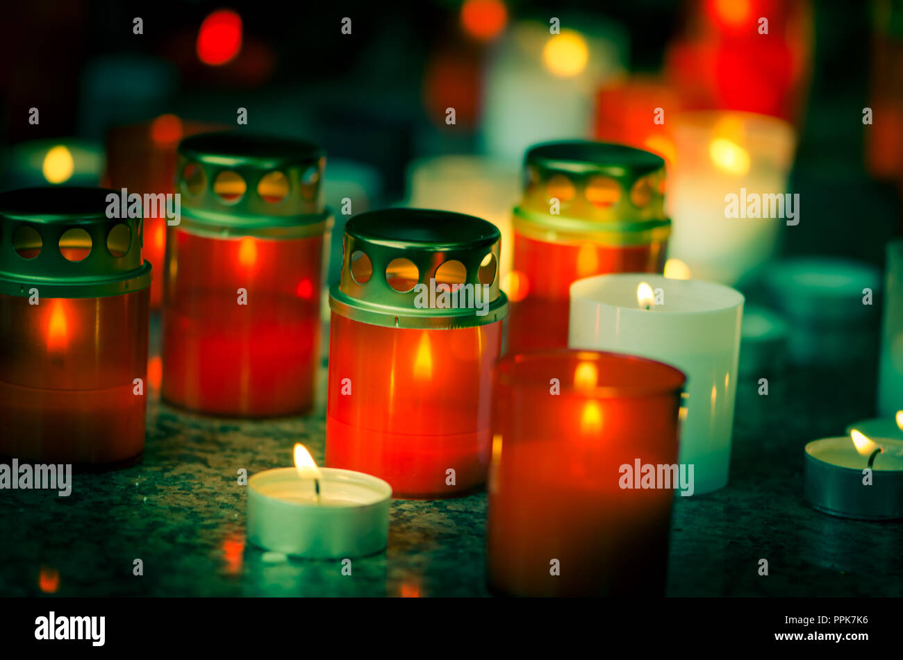 colorful candles during All Saints Day at the cemetery Stock Photo Alamy