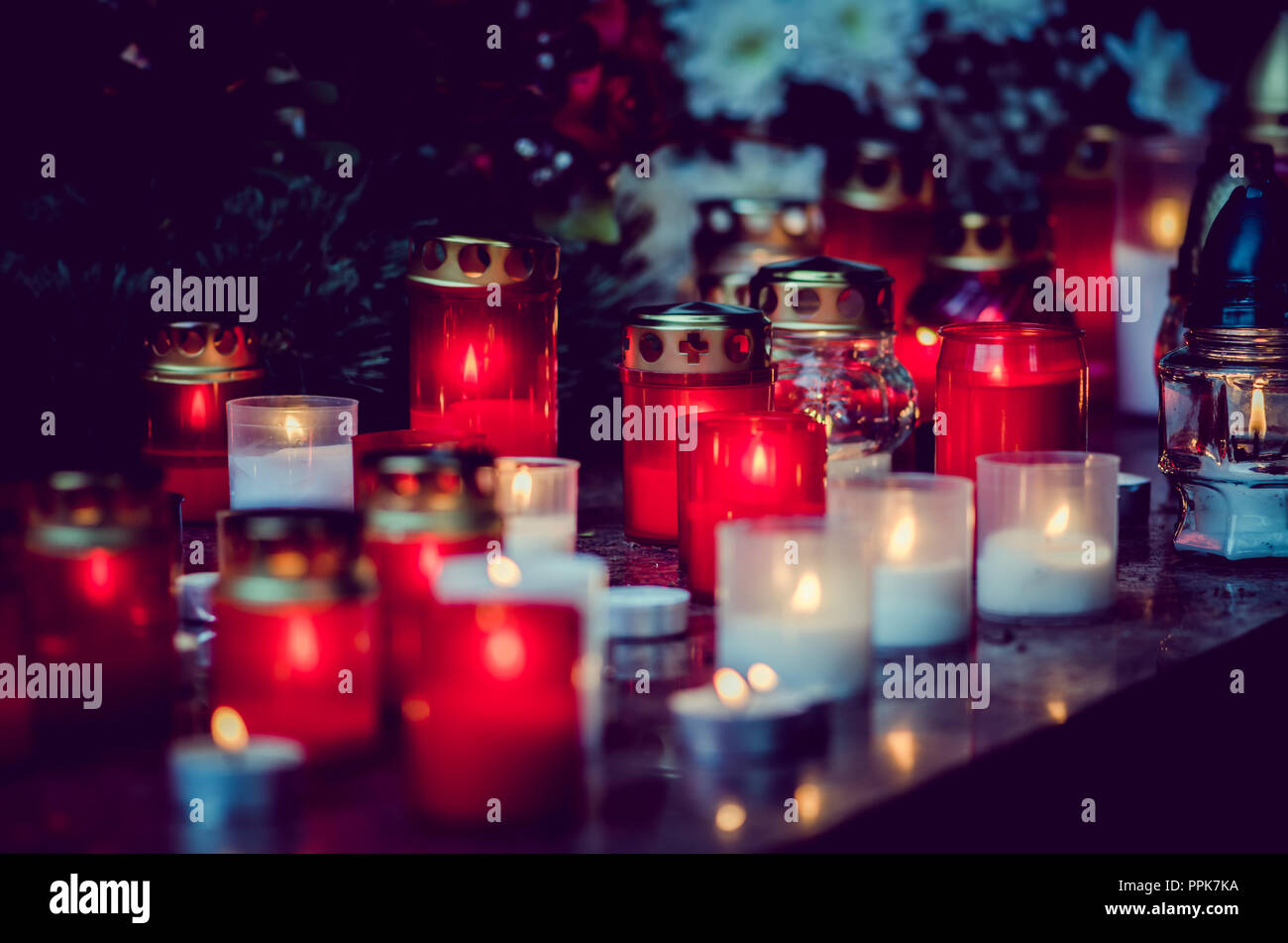 colorful candles during All Saints Day at the cemetery Stock Photo Alamy