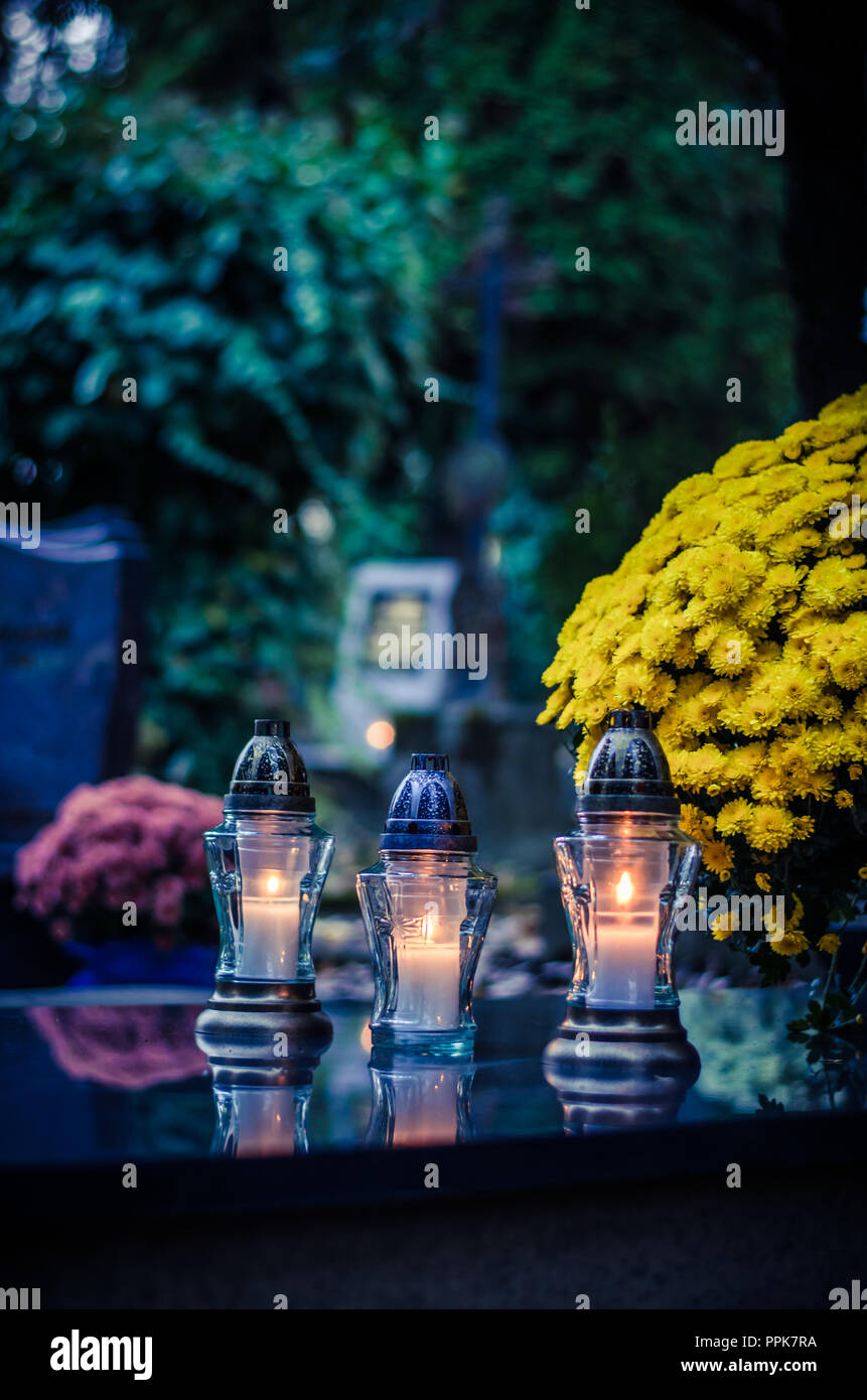 colorful burning candles during All Saints Day at the cemetery Stock Photo Alamy