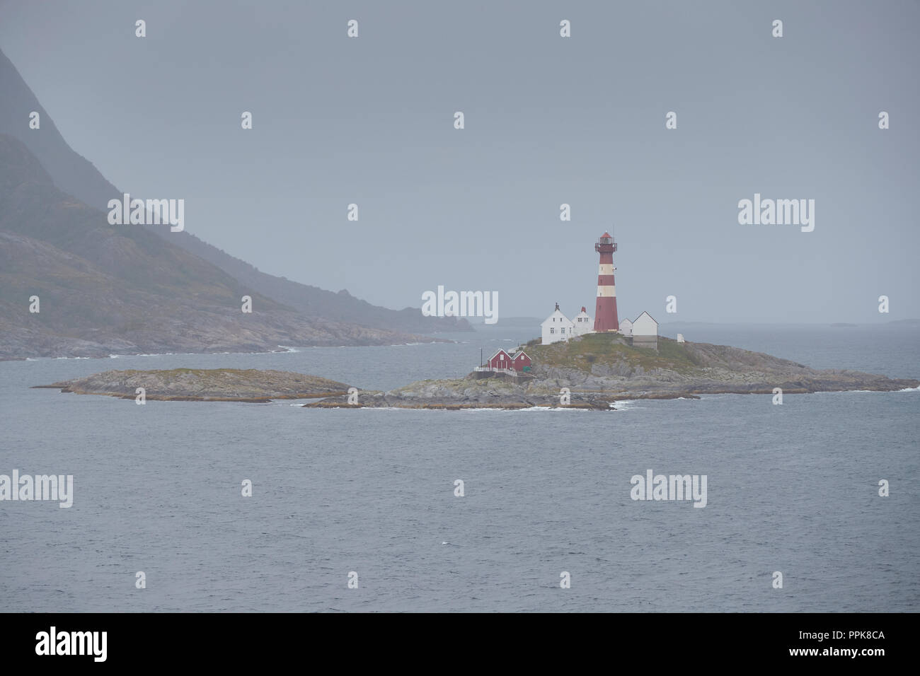 The Norwegian Landegode Lighthouse (Landegode Fyr), located on the small island of Eggløysa, About 100 Km North Of The Arctic Circle. Norway. Stock Photo