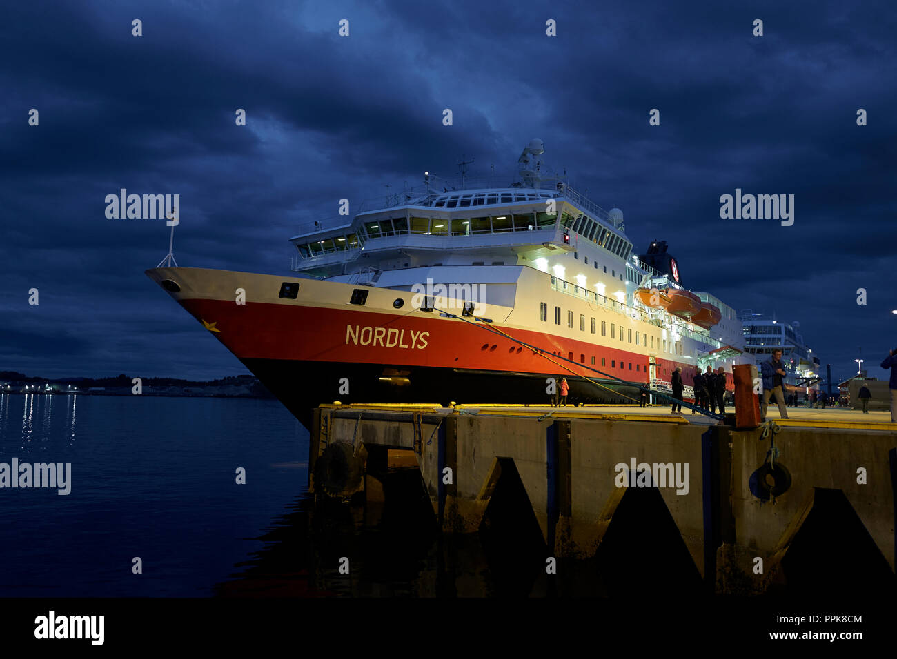 The Hurtigruten Passenger Ship, MS NORDLYS, Moored In Rørvik At Dusk. Stock Photo