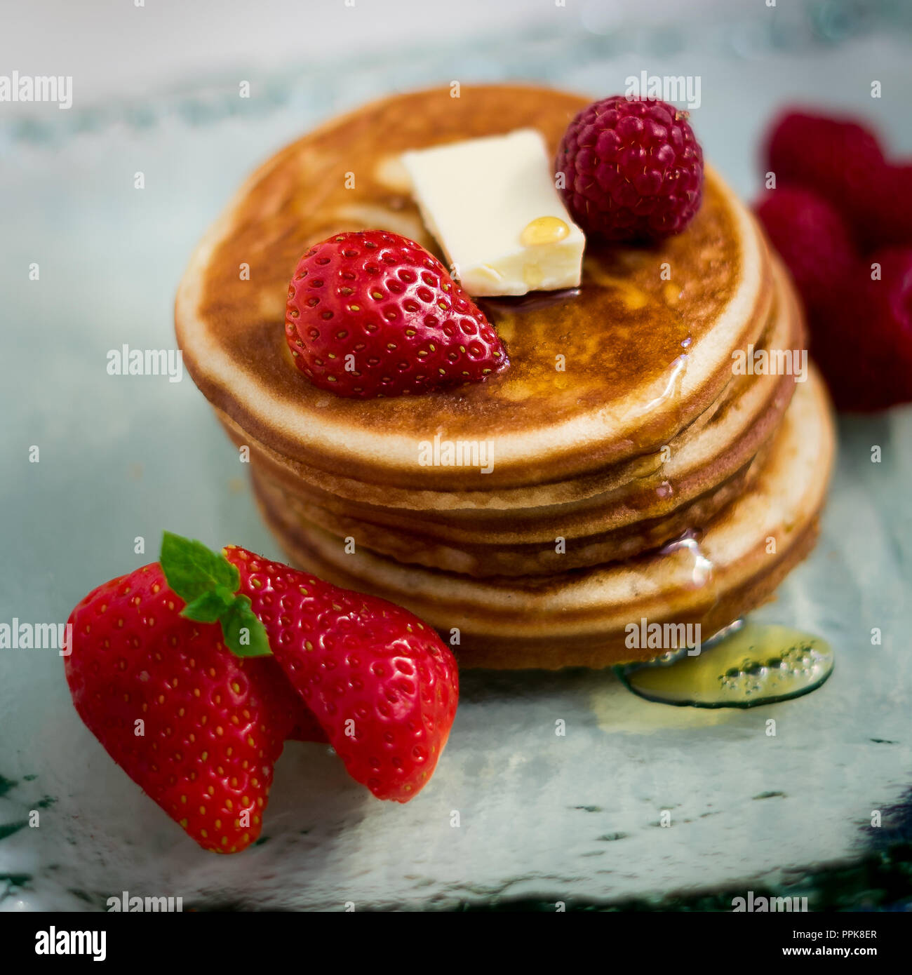 American style pancakes with maple syrup and fruits Stock Photo