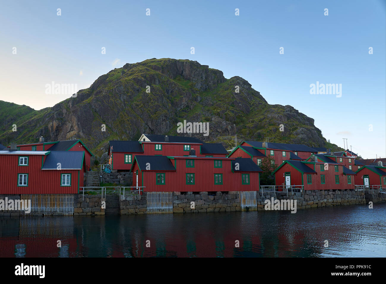 Restored Fishermen's Shacks (Rorbuer or Rorbu), Painted In The Traditional Falun Red (Falu Red), In The Fishing Village Of Stamsund, Lofoten Islands. Stock Photo
