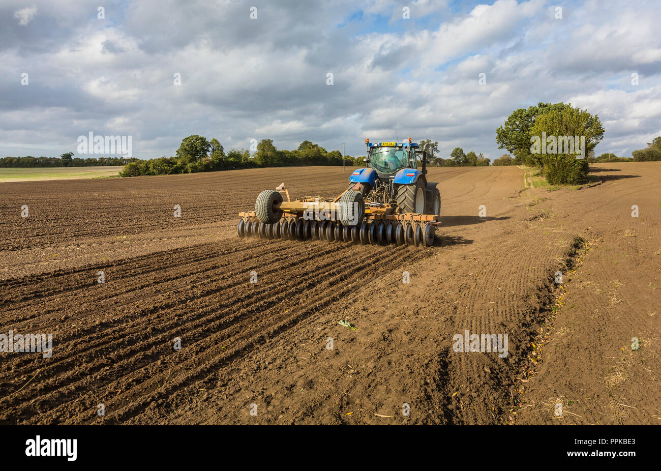 Tilling a field, Suffolk, UK Stock Photo Alamy