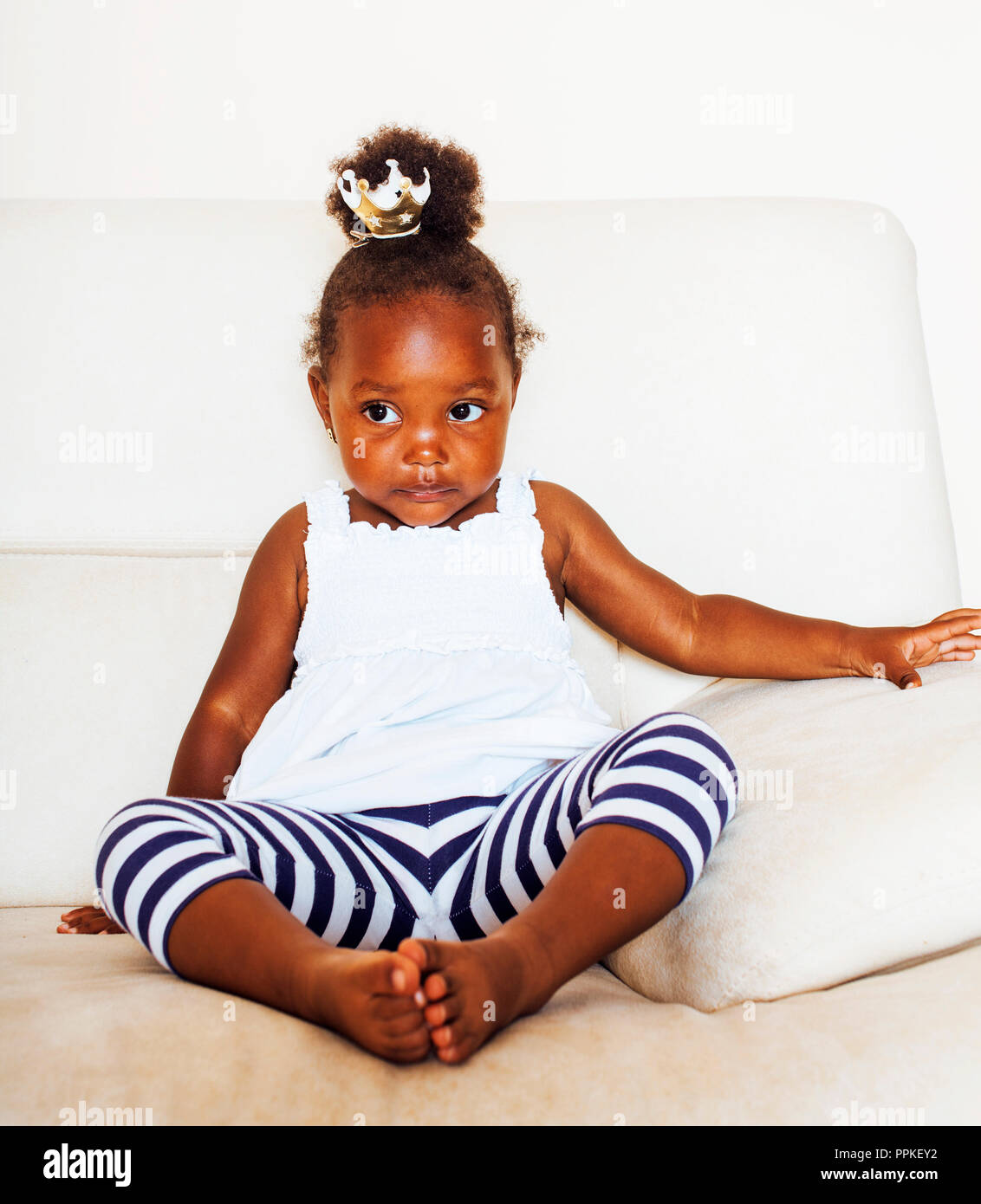 Little Cute African American Girl Playing With Animal Toys At Ho