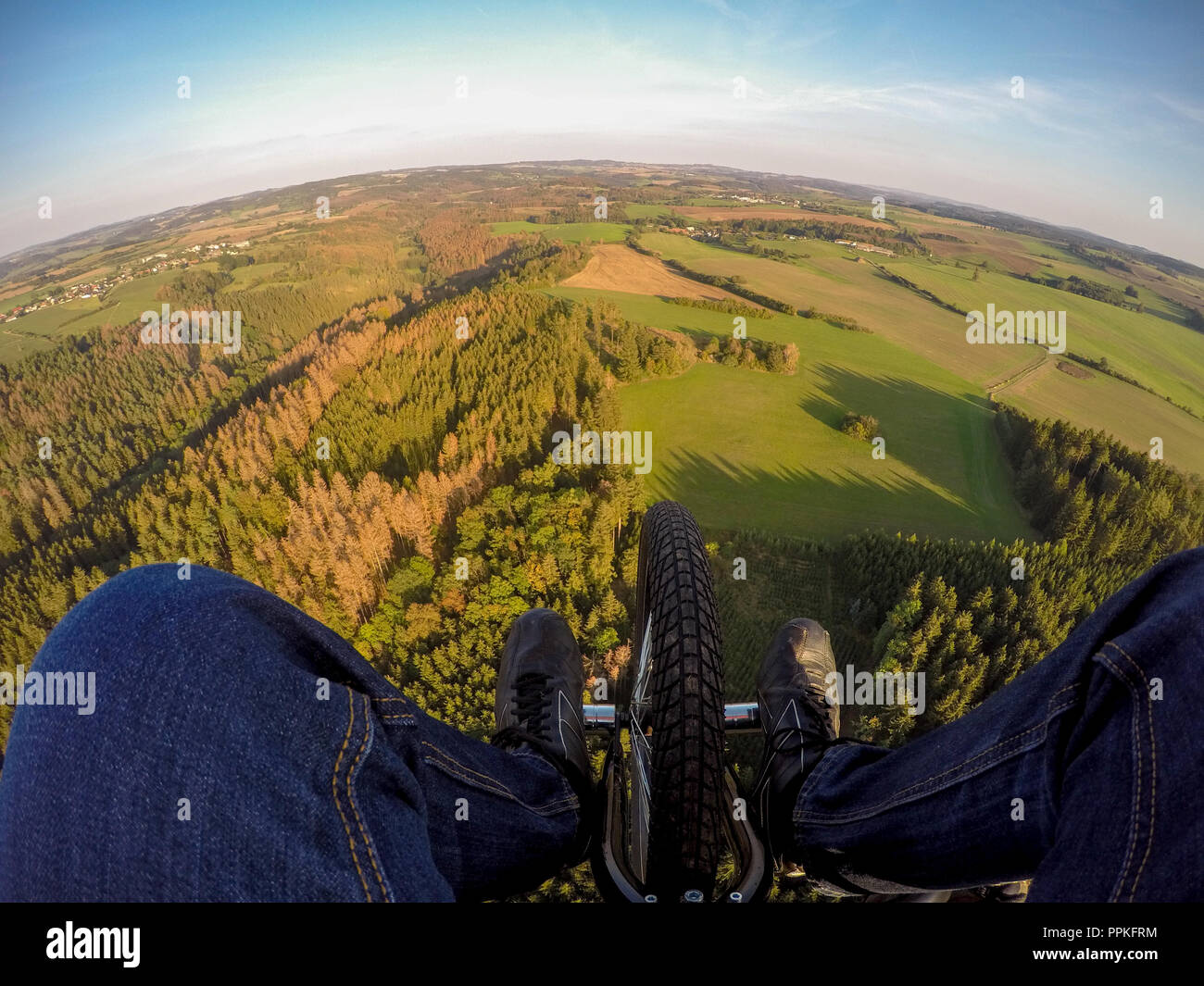 Powered paragliding tandem flight, point of view to ground Stock Photo