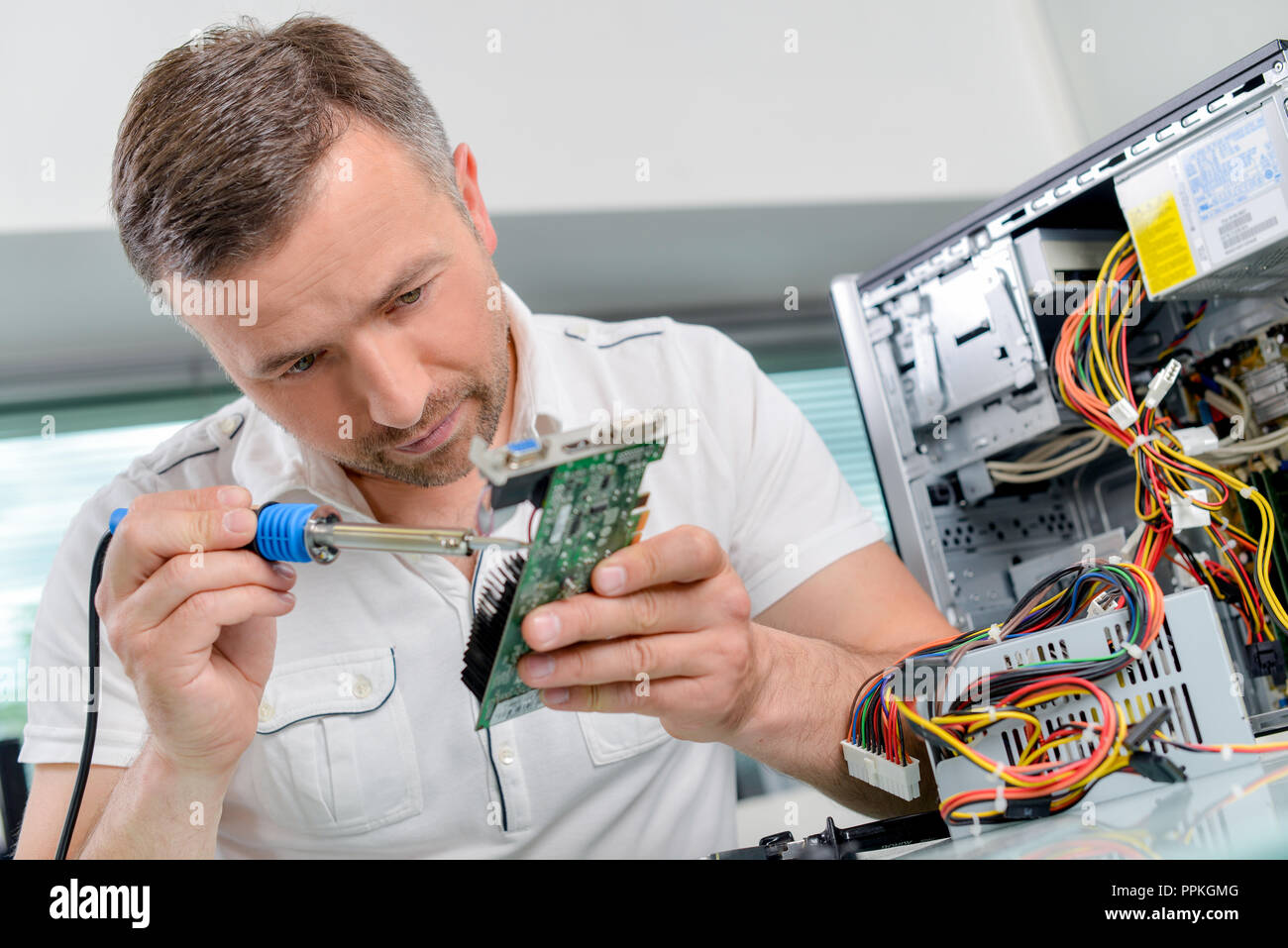 Soldering computer parts Stock Photo Alamy