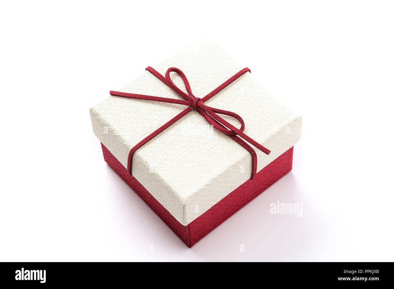 White and red gift box isolated on white background Stock Photo - Alamy