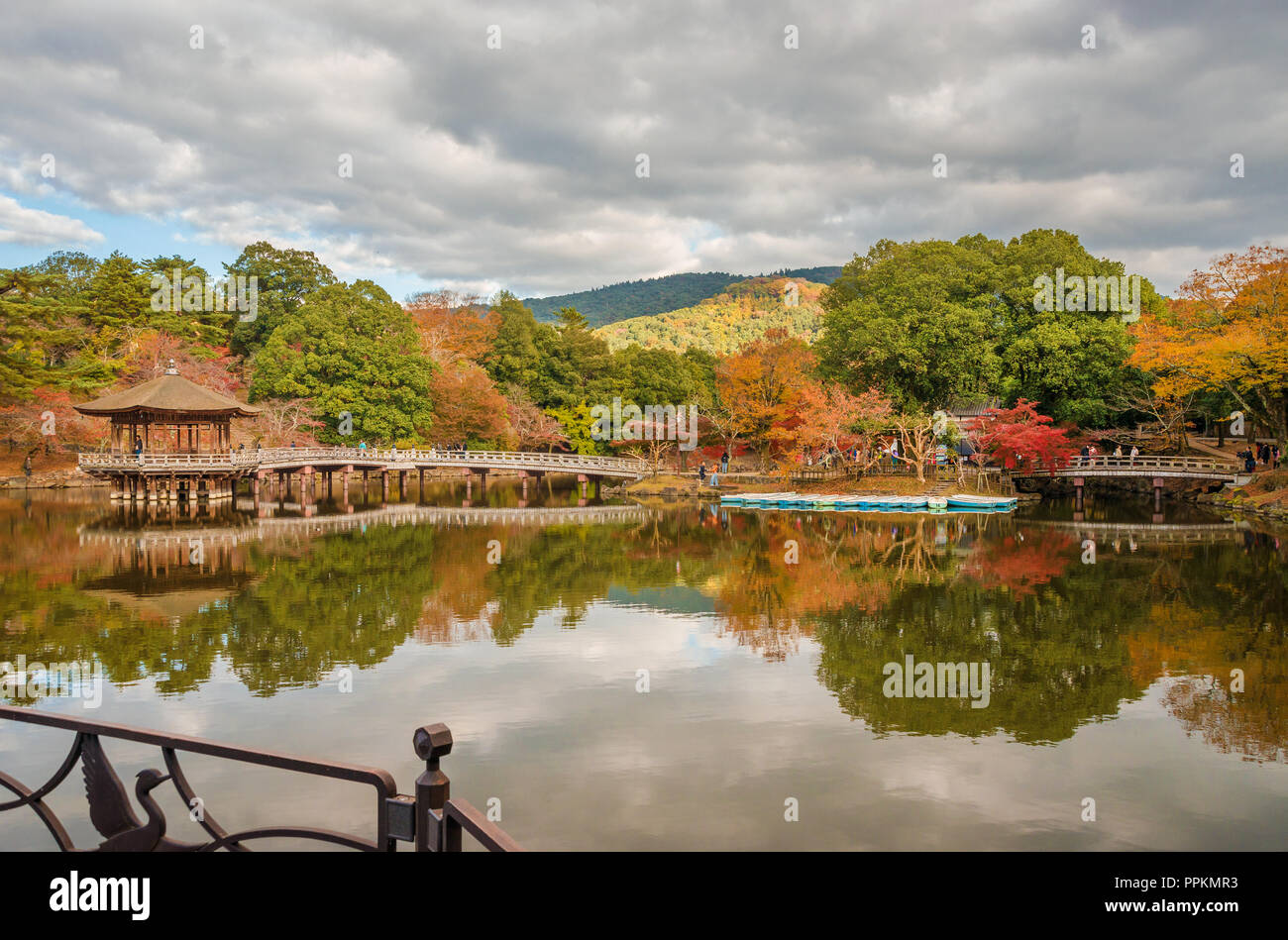 View of Nara public park in autumn, with pond and old pavilion Stock Photo
