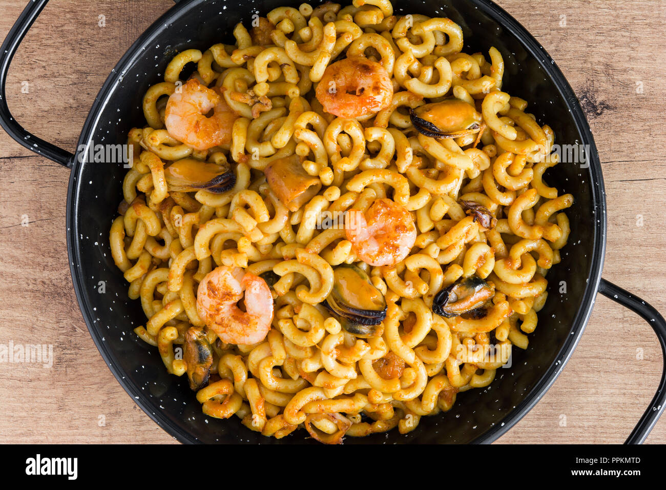 Traditional Spanish fideua. Noodle paella isolated on white background. Top  view Stock Photo - Alamy