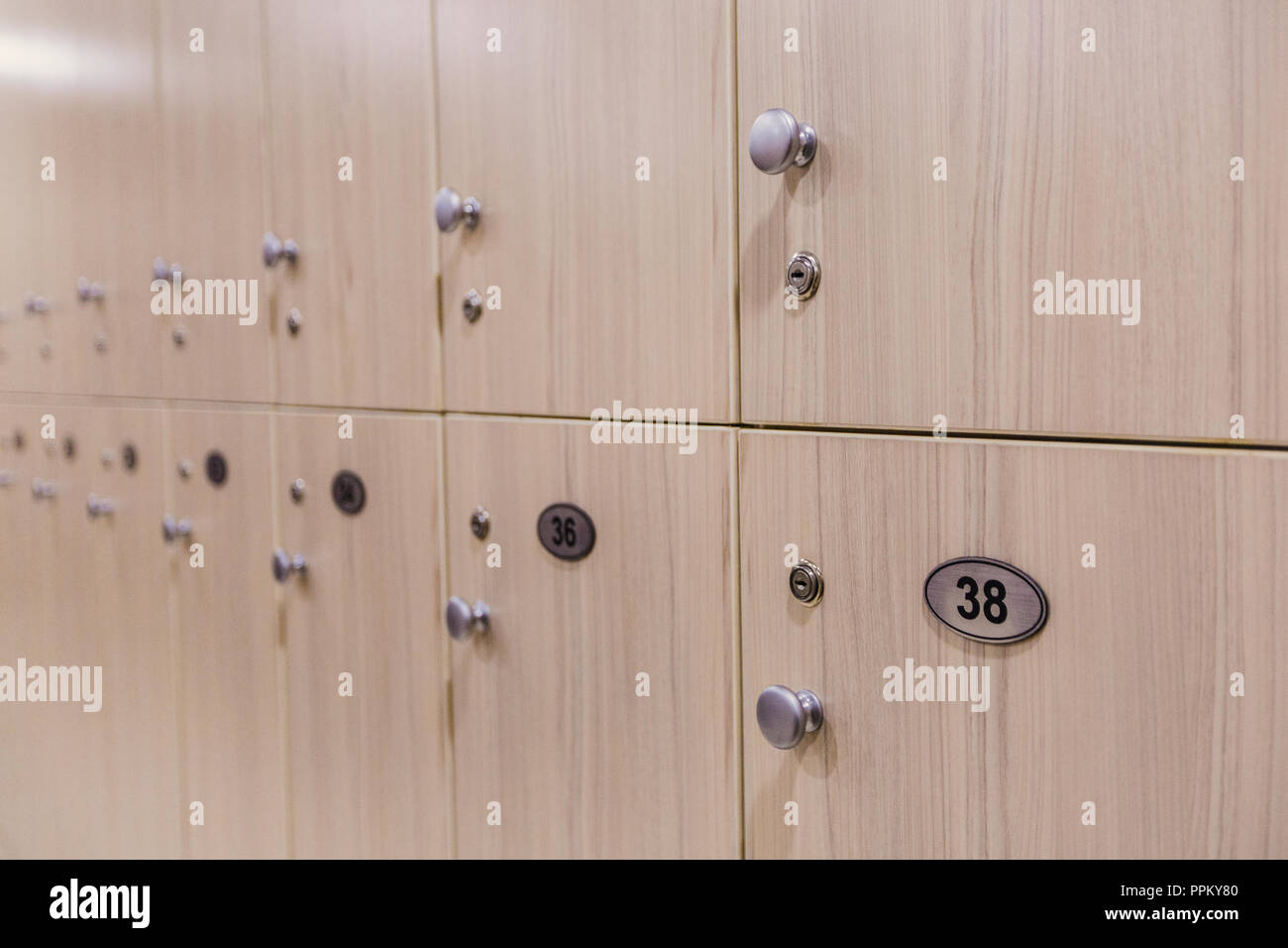 Cloakroom in hotel or gym, wooden scales, background Stock Photo Alamy