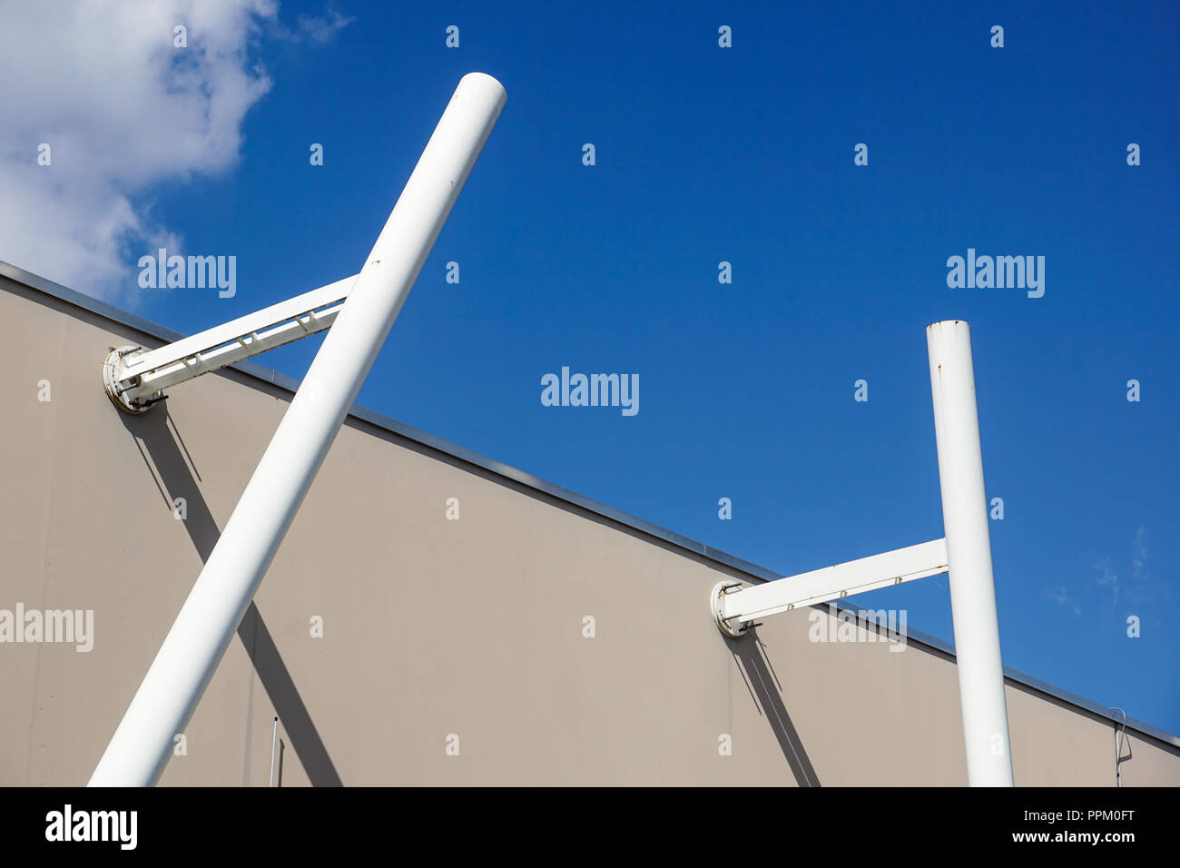 metal structure with a ladder on a background of blue sky Stock Photo