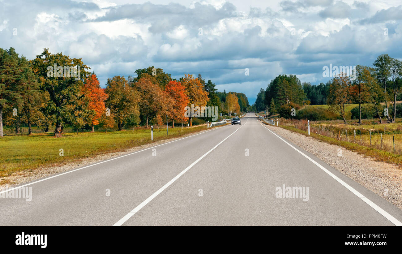 Autumn landscape with asphalt road and forest Stock Photo - Alamy