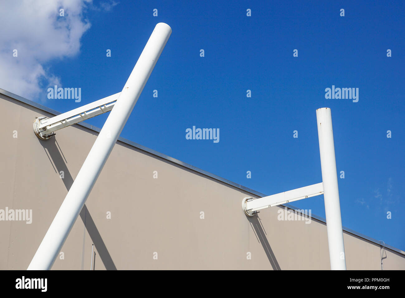 metal structure with a ladder on a background of blue sky Stock Photo