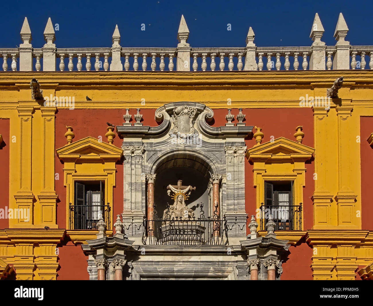 Bright colors of the Palace of the Bishop of Malaga on a sunny day with clear blue sky Stock Photo