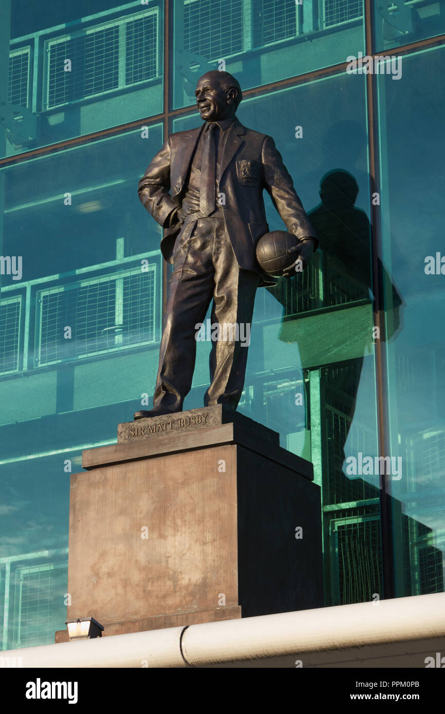 Statue of Sir Matt Busby, iconic football manager, in front of Old Trafford, Manchester United's home stadium Stock Photo