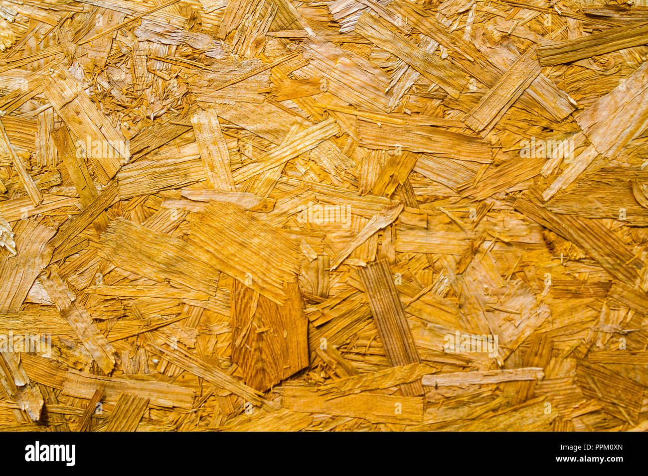 Recycled compressed wood chipboard as texture and background Stock